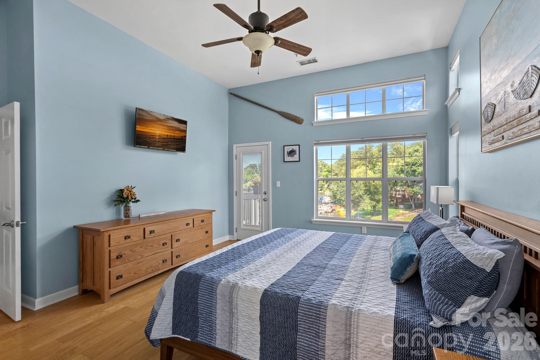 Primary Bedroom- Views of the water and Mechanical Shades - 103 Pier 33 Drive, Mooresville