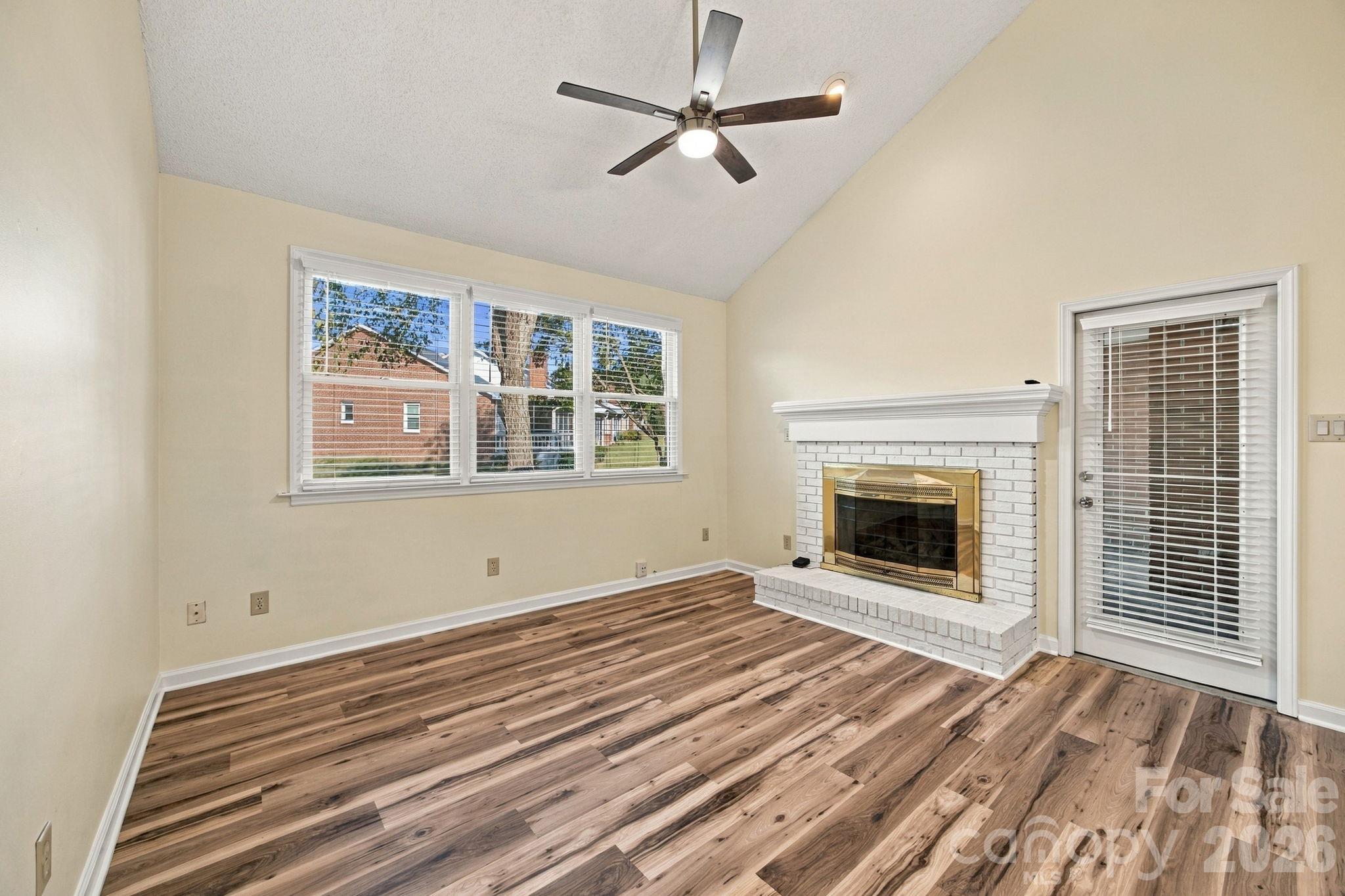Living room, gas fire place and entry to the screen porch - 19838 Oak Leaf Circle, Cornelius