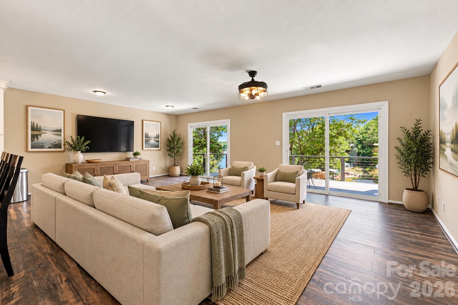 Virtually Staged Family Room with views of the lake and upper deck - 9071 Tulagi Court, Tega Cay