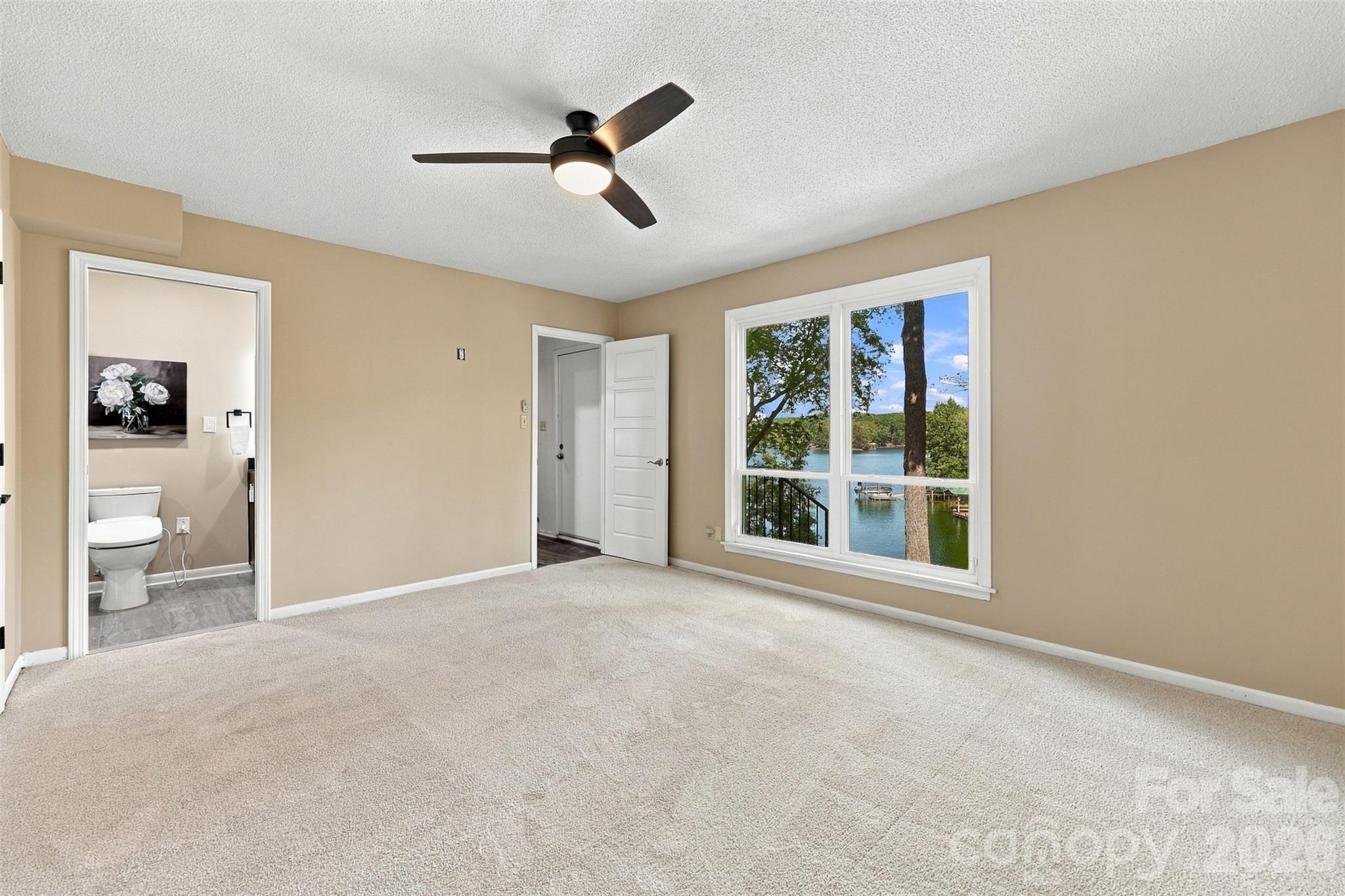 Water views from lower level primary bedroom - 9071 Tulagi Court, Tega Cay