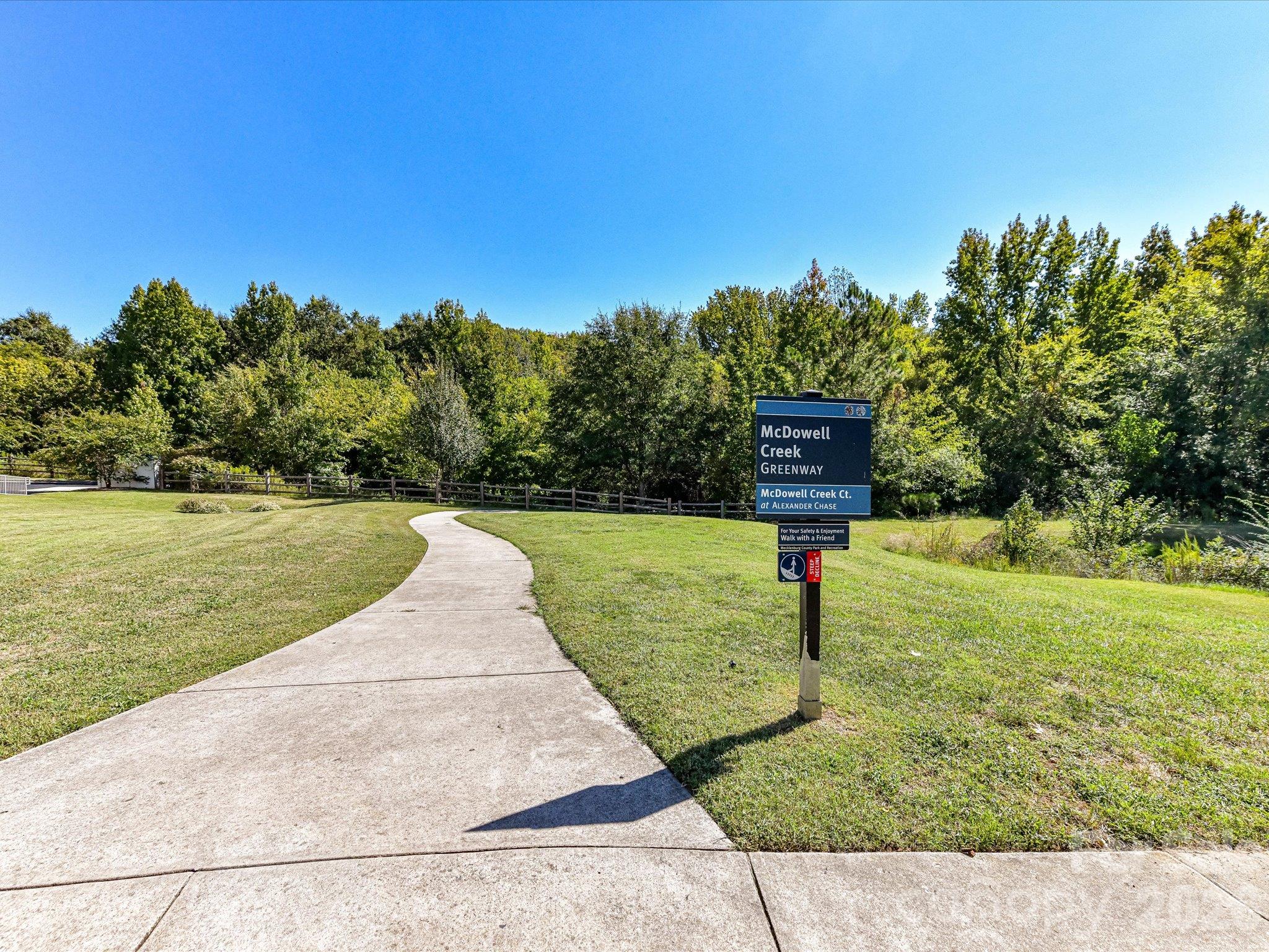 Convenient access to the McDowell Creek Greenway offers a scenic paved trail surrounded by green space for walking, jogging, and outdoor recreation. - 9031 Mcdowell Creek Court, Cornelius