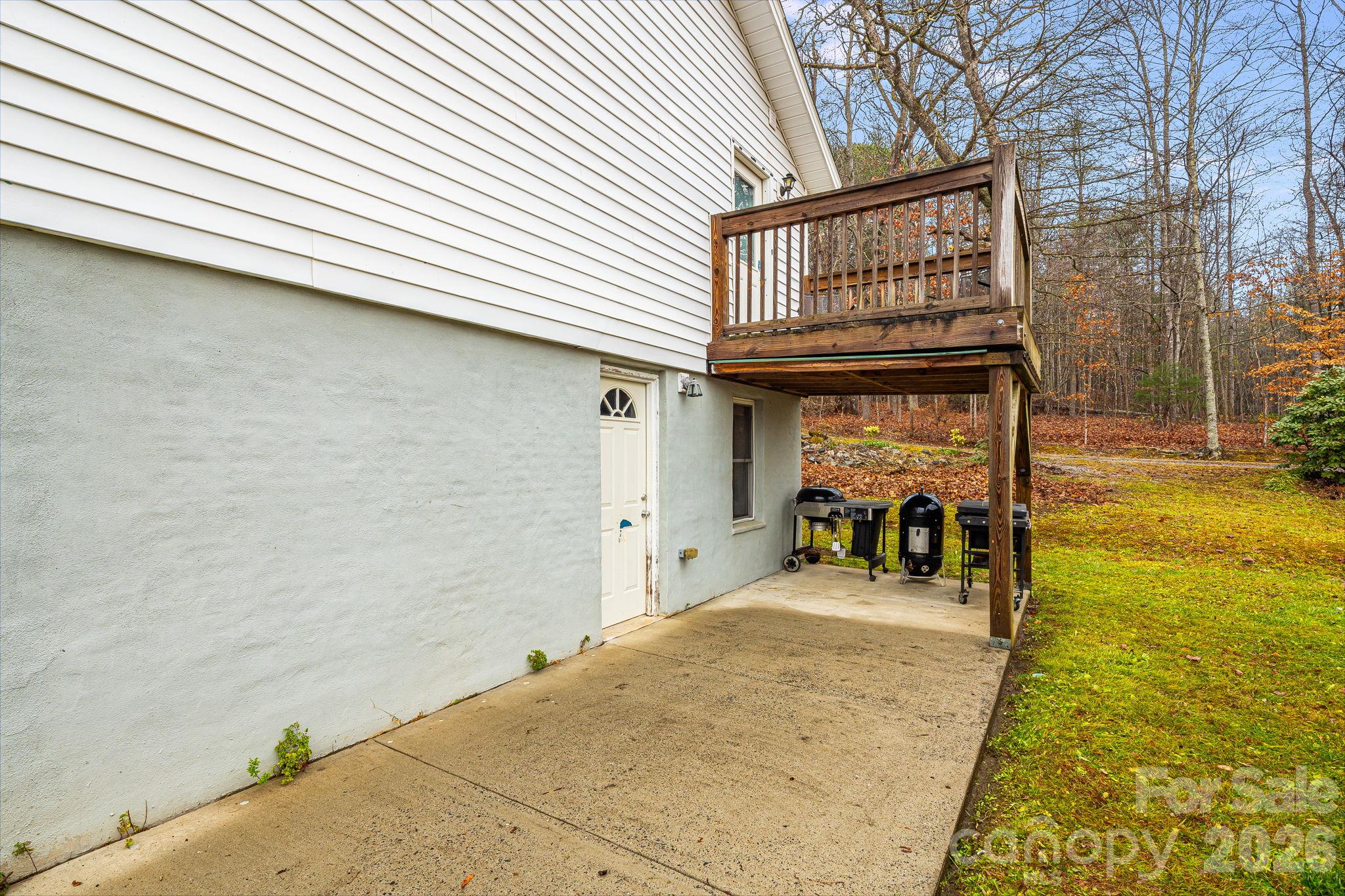Back of home, Basement access door - 195 Whitmire Road, Brevard