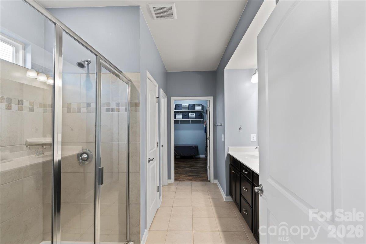 Primary En Suite Bathroom with standing shower with bench - 2003 Harvest Time Lane, Waxhaw