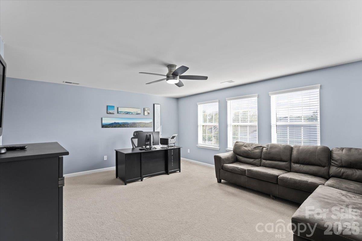 Spacious upstairs Loft can be used as office, flex space, movie room, game room or hobby room, 3 windows allow for lots of natural light - 2003 Harvest Time Lane, Waxhaw