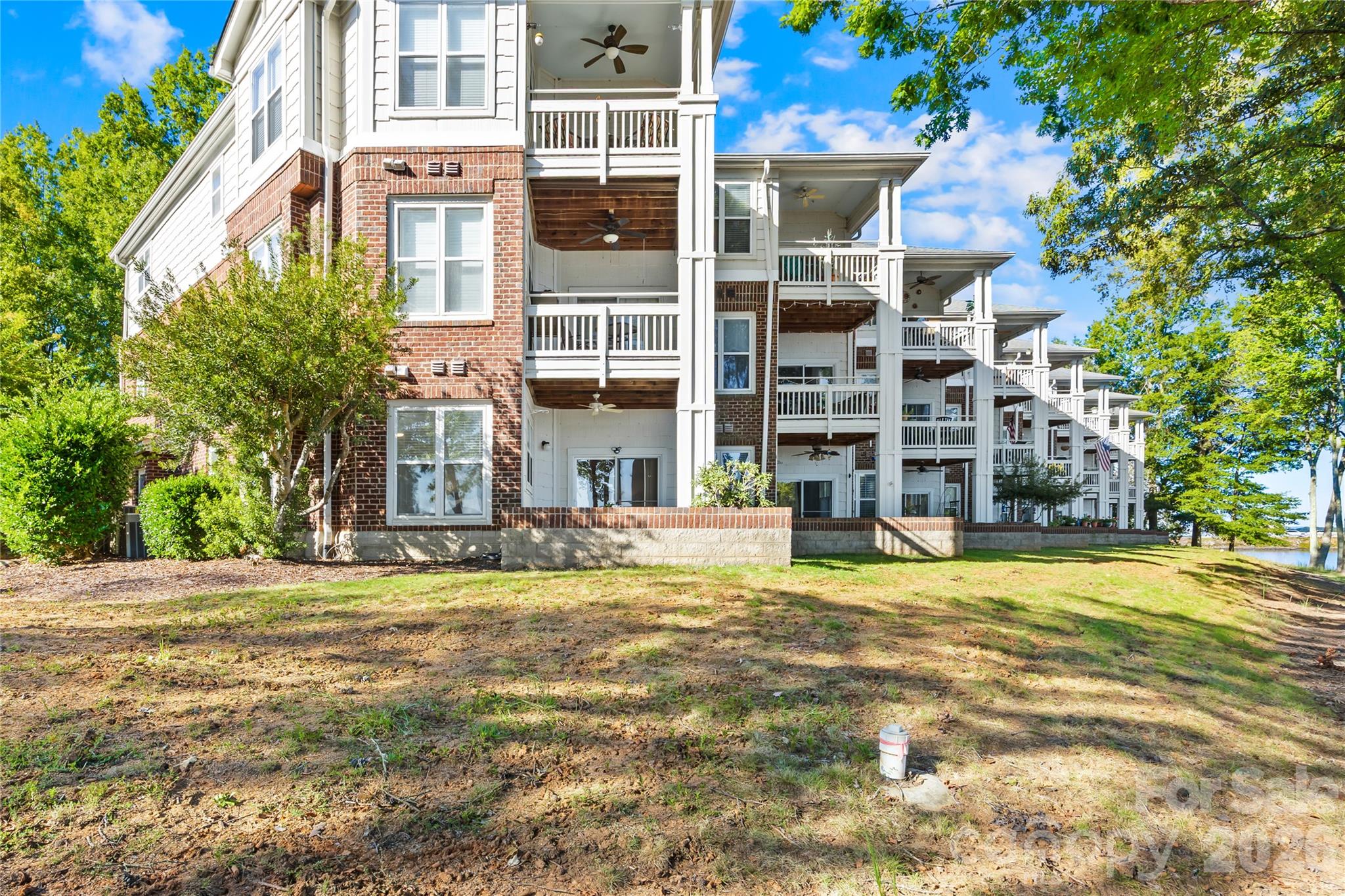 Tucked away in the farthest, ground corner of the building with additional windows for tons of sunlight and water views! - 915 Northeast Drive, Davidson