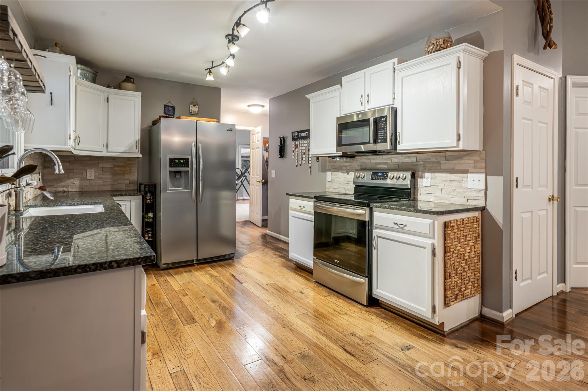 Updated Kitchen Features Granite and Stainless Steel - 19 Forge Drive, Mills River