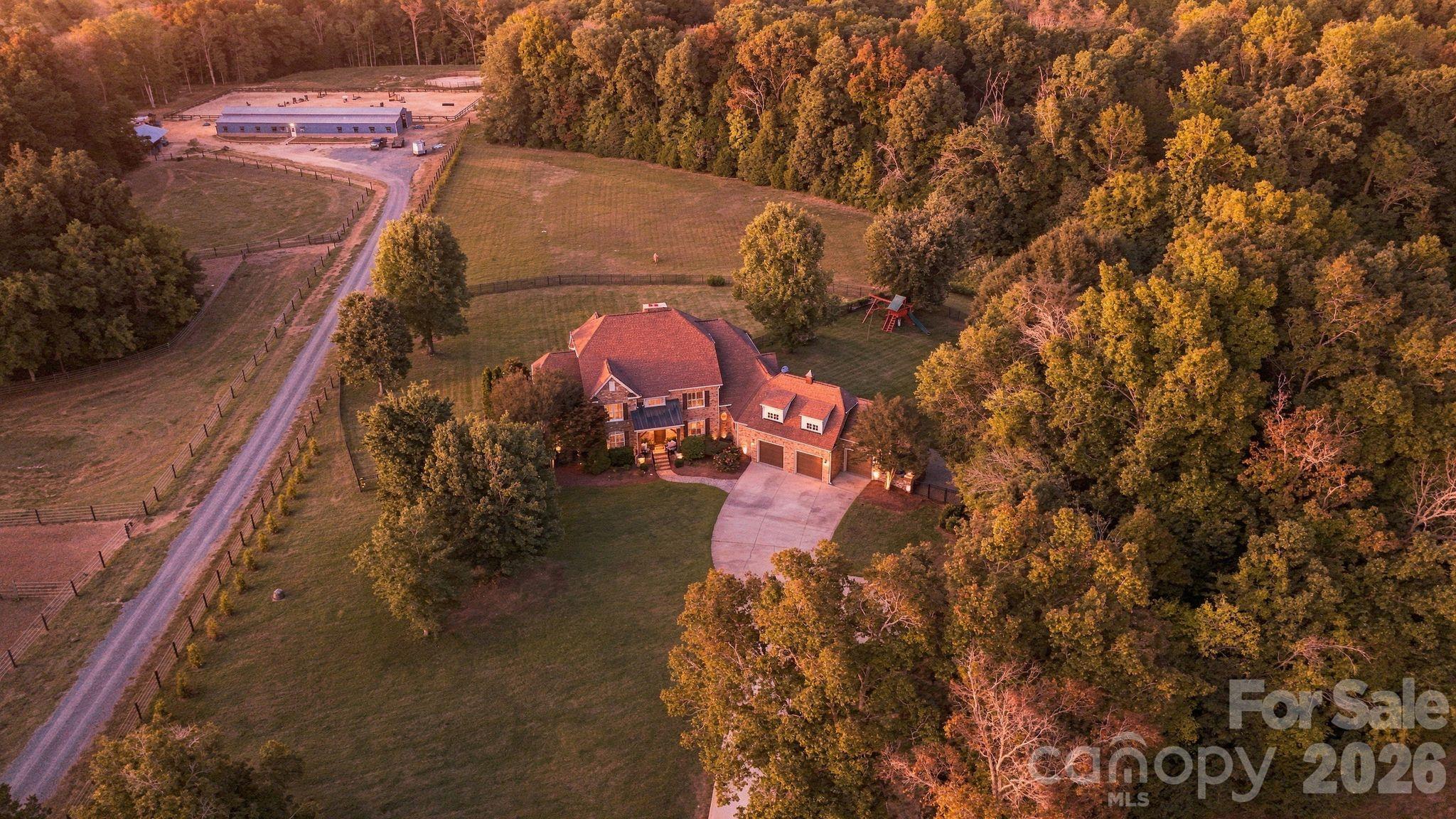 Over 11 acres includes fenced grounds, private stocked pond, woods, and dedicated RV spot with electrical and septic. - 7275 Flowes Store Road, Concord