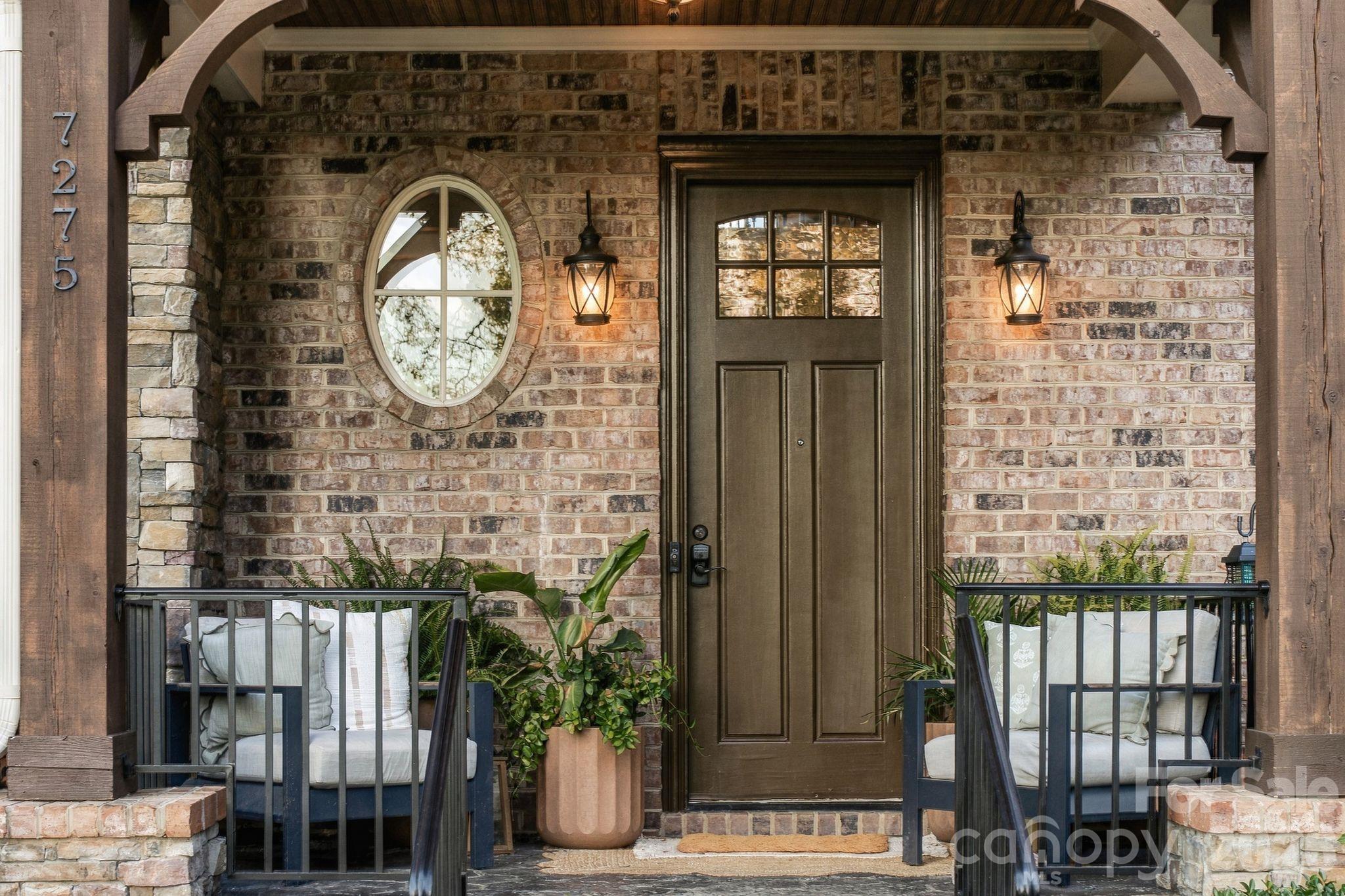 Welcoming covered front porch to greet your guests - 7275 Flowes Store Road, Concord