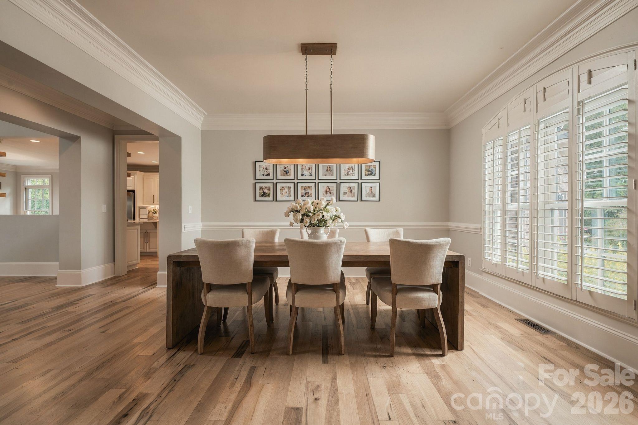 Formal dining complemented by natural wood floors - 7275 Flowes Store Road, Concord