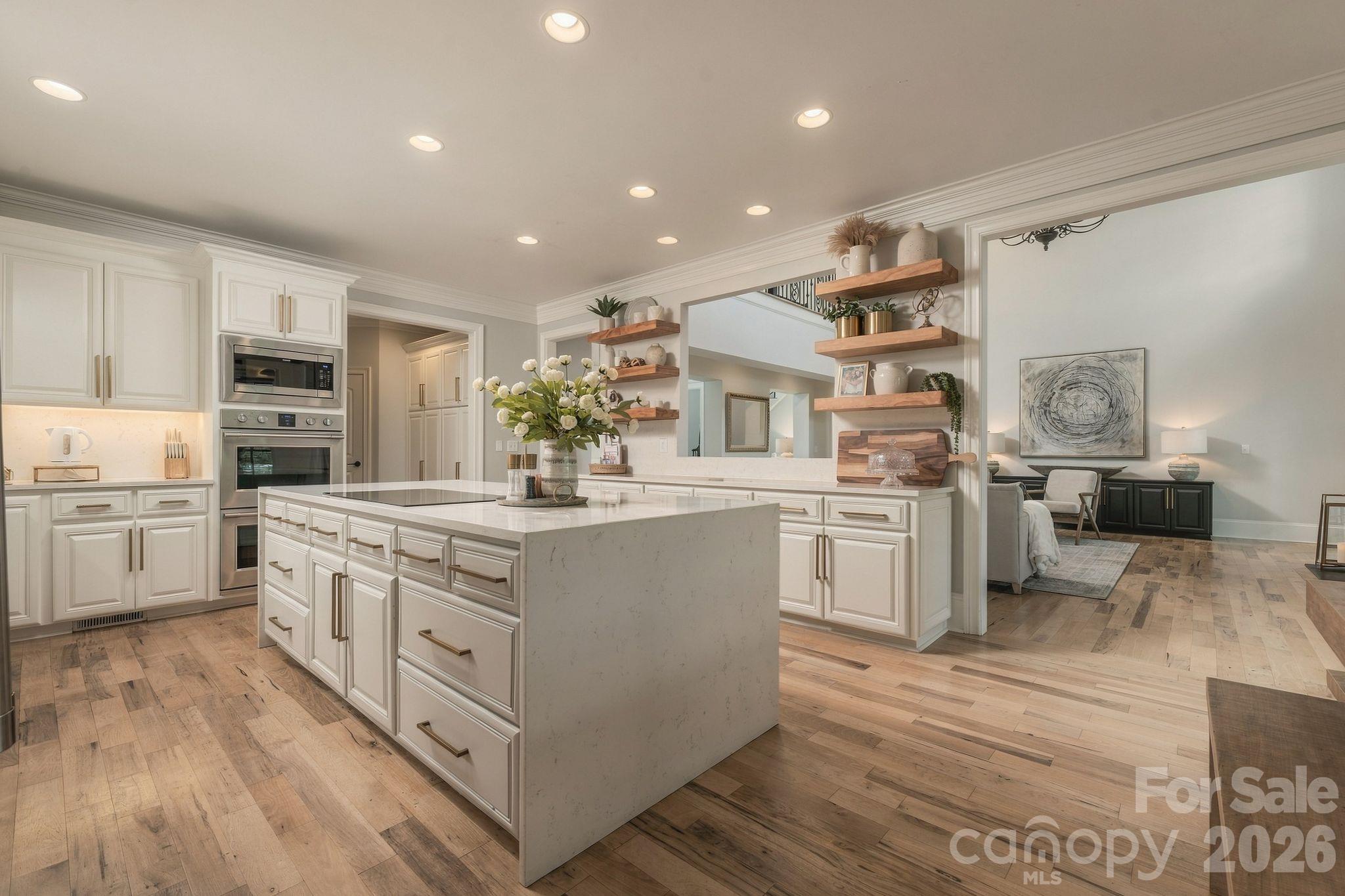 Kitchen designed for function and flow between living spaces - 7275 Flowes Store Road, Concord