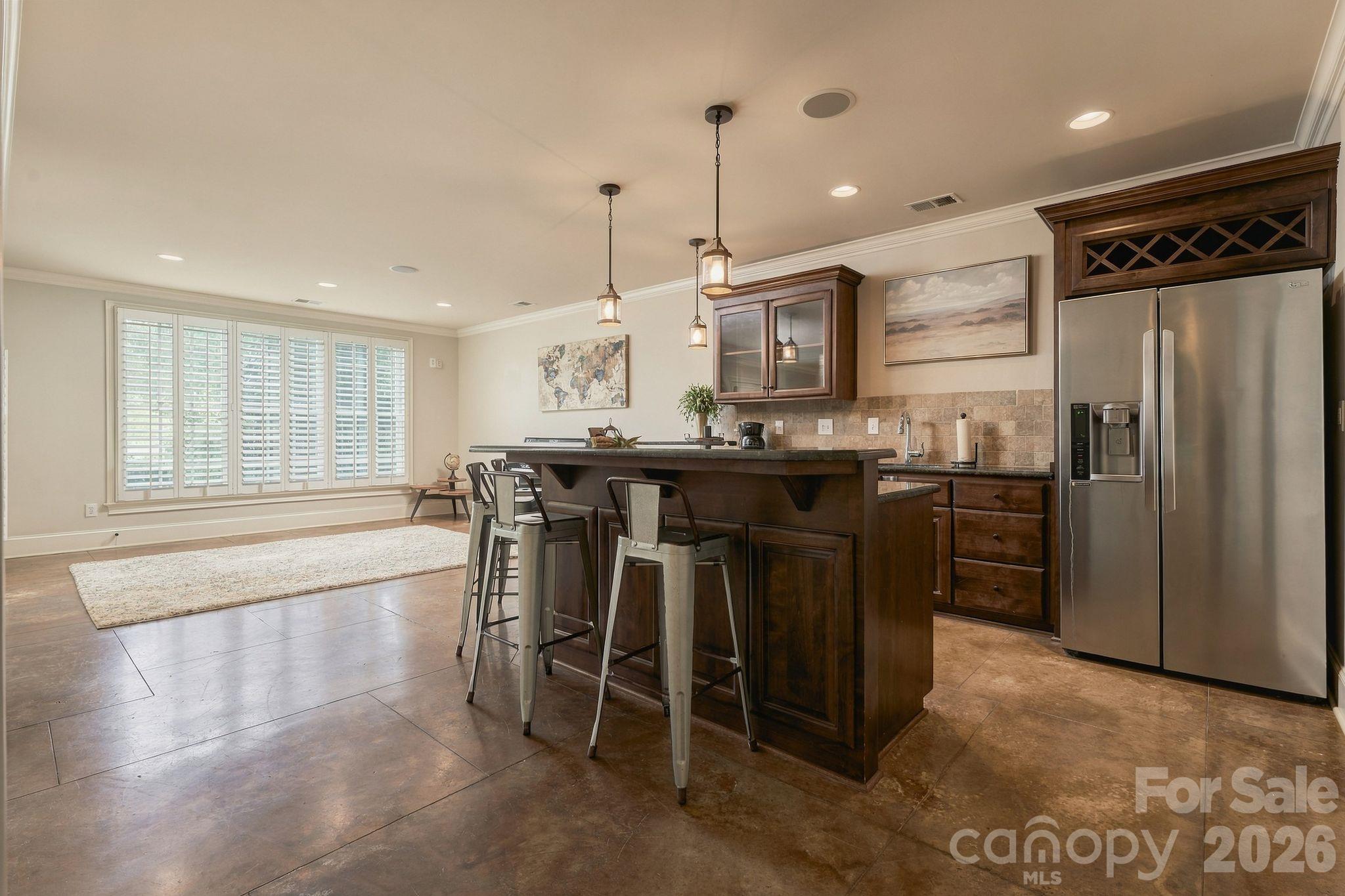 Basement bar/kitchenette features full refrigerator, dishwasher, and sink - 7275 Flowes Store Road, Concord
