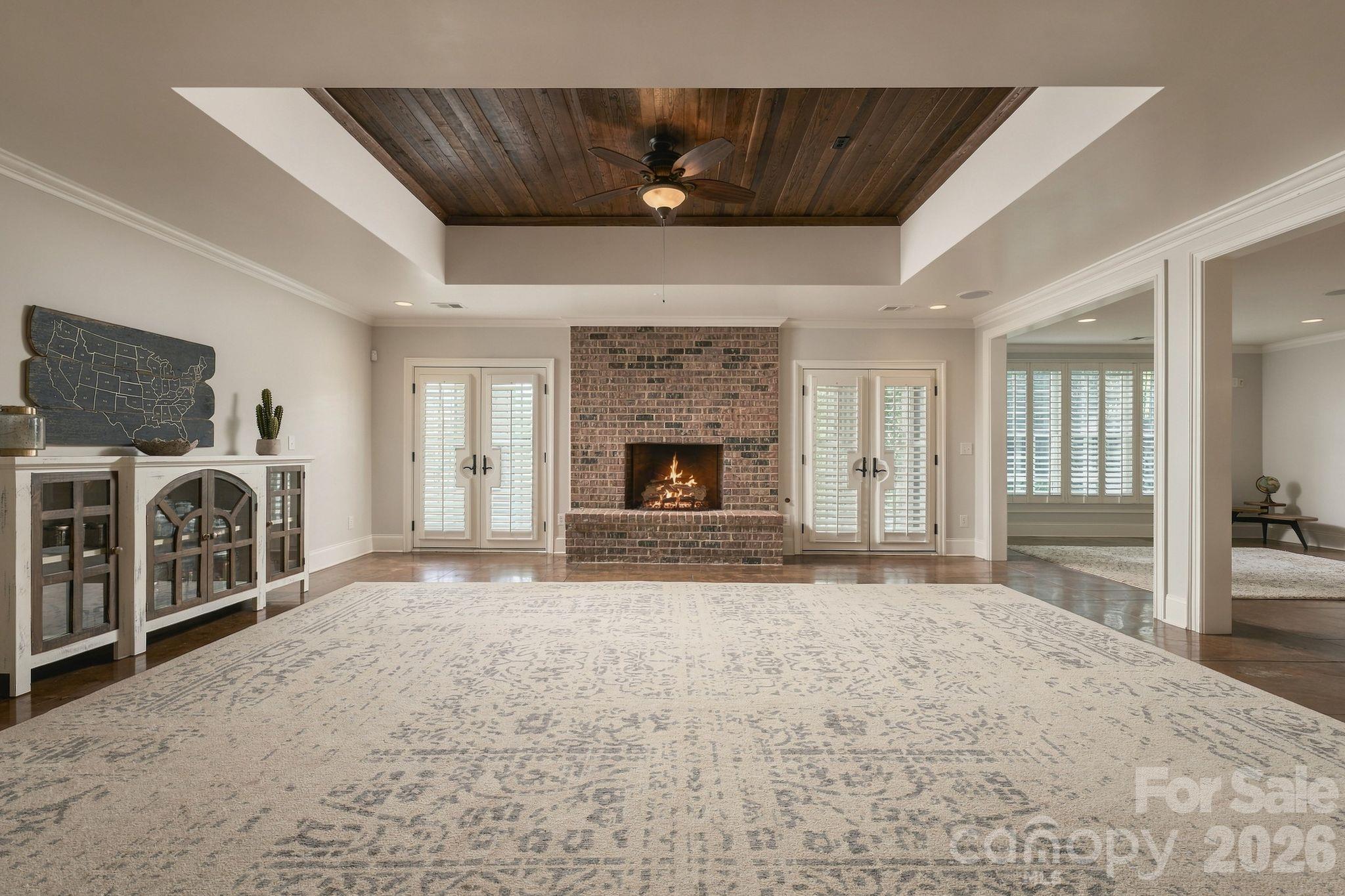 Basement rec room with gorgeous wood details and wood burning fire place - 7275 Flowes Store Road, Concord
