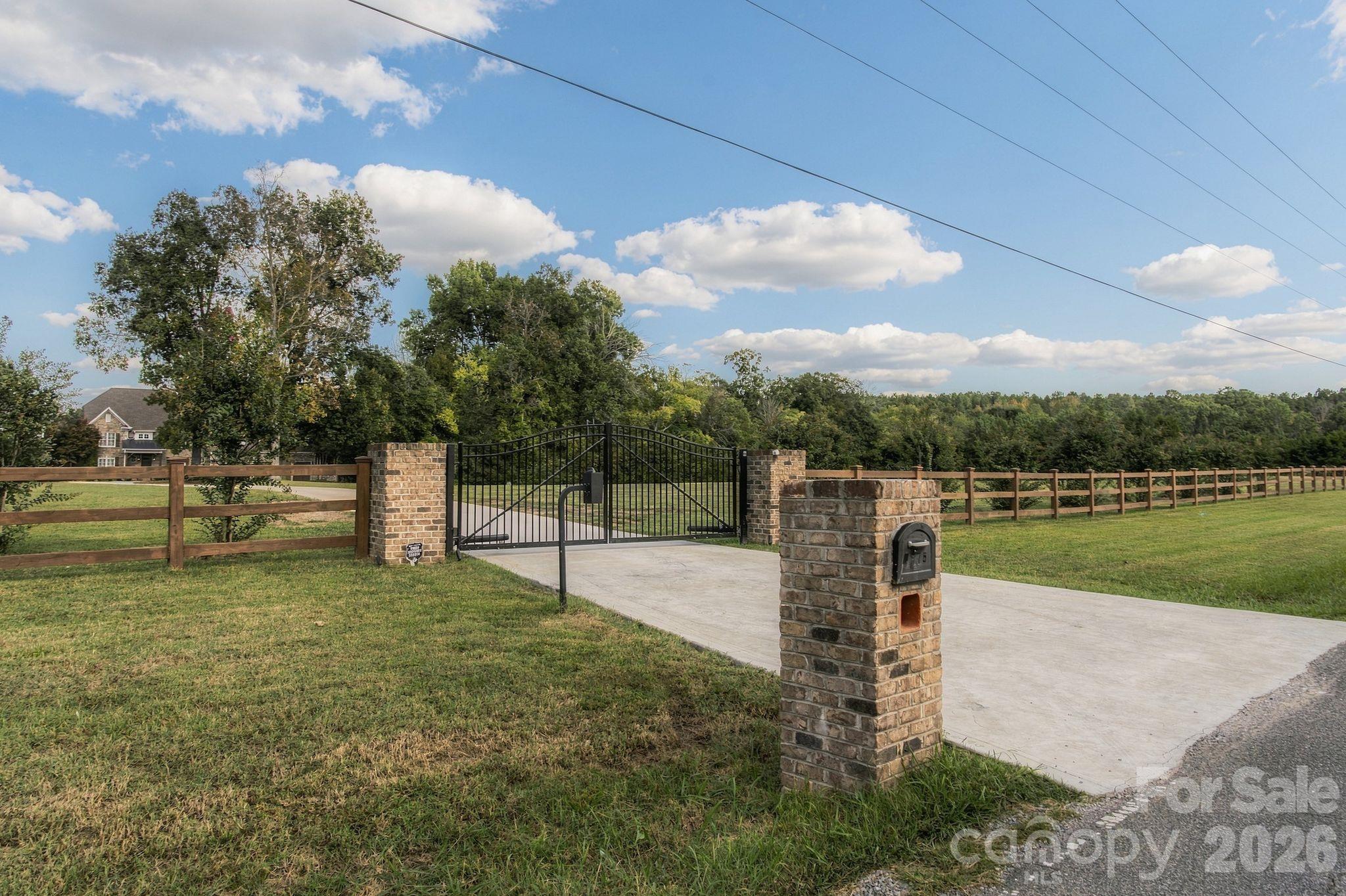 Gated entrance allows for secure, private living - 7275 Flowes Store Road, Concord
