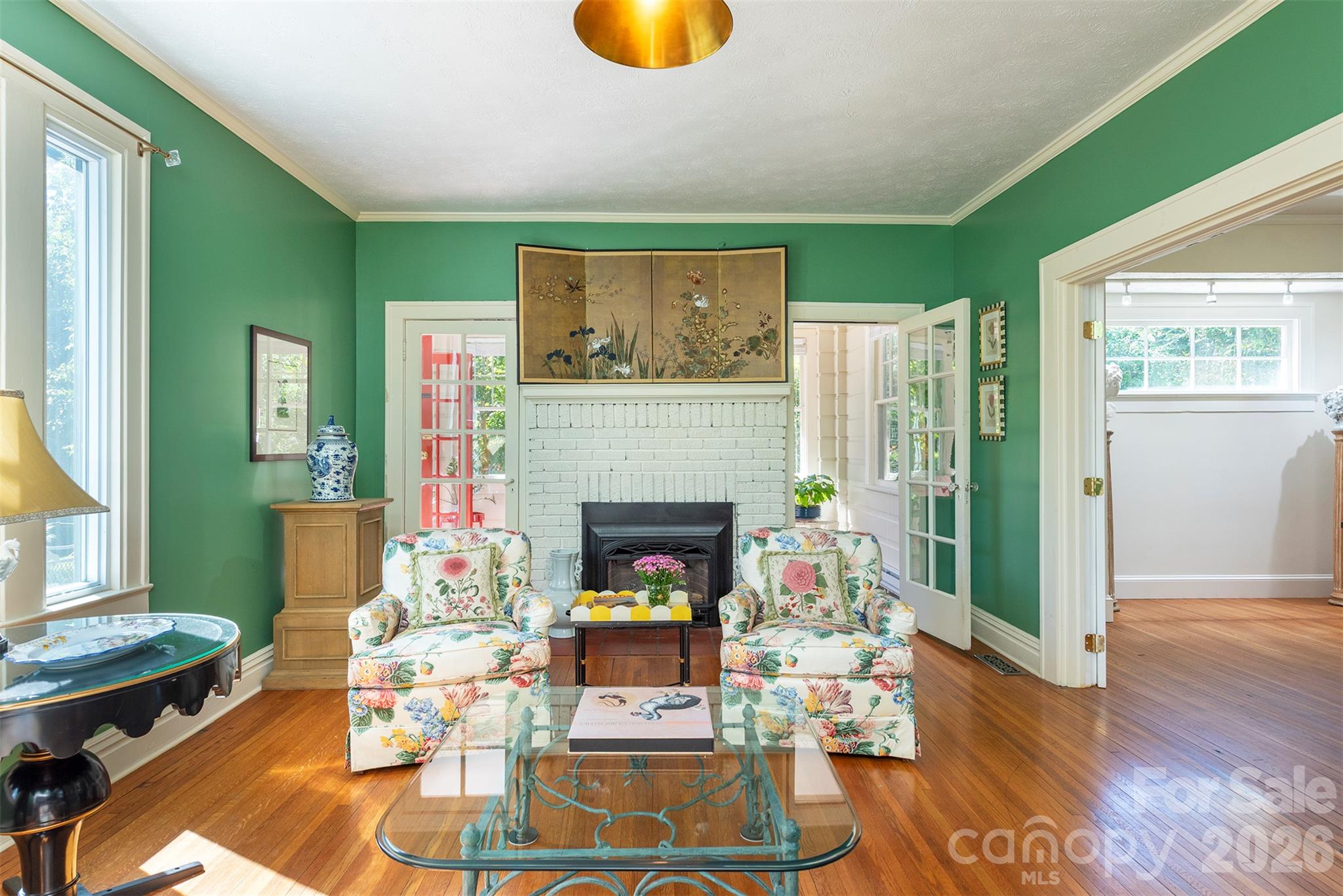 Living Room opens up to the sunroom. - 710 Merrimon Avenue, Asheville