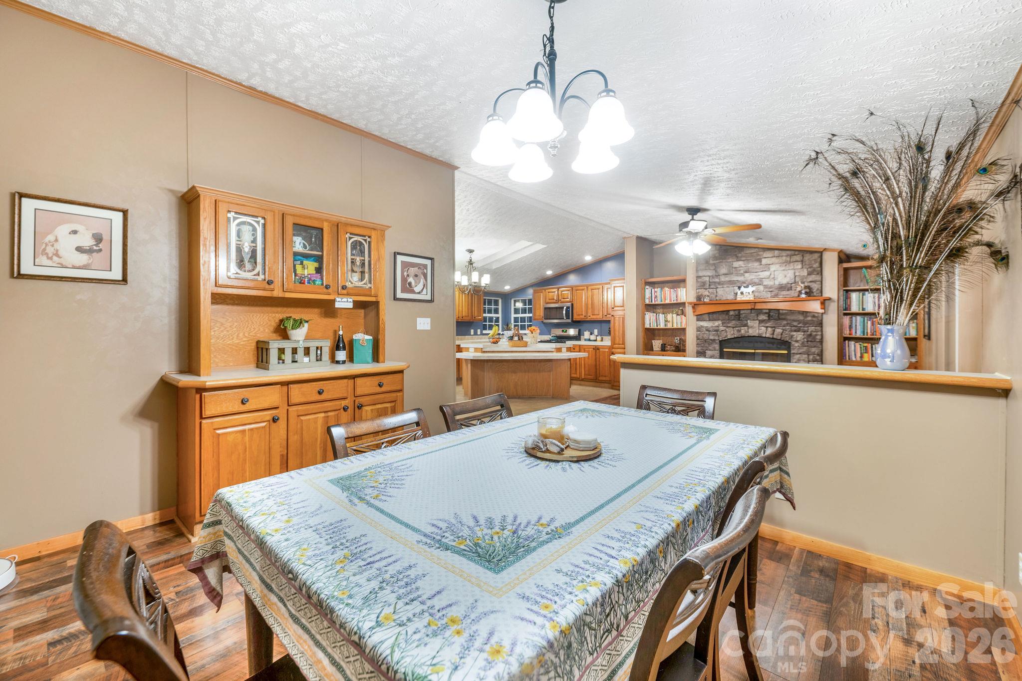 View from dining room to den and kitchen. - 1102 Price Town Road, Clyde