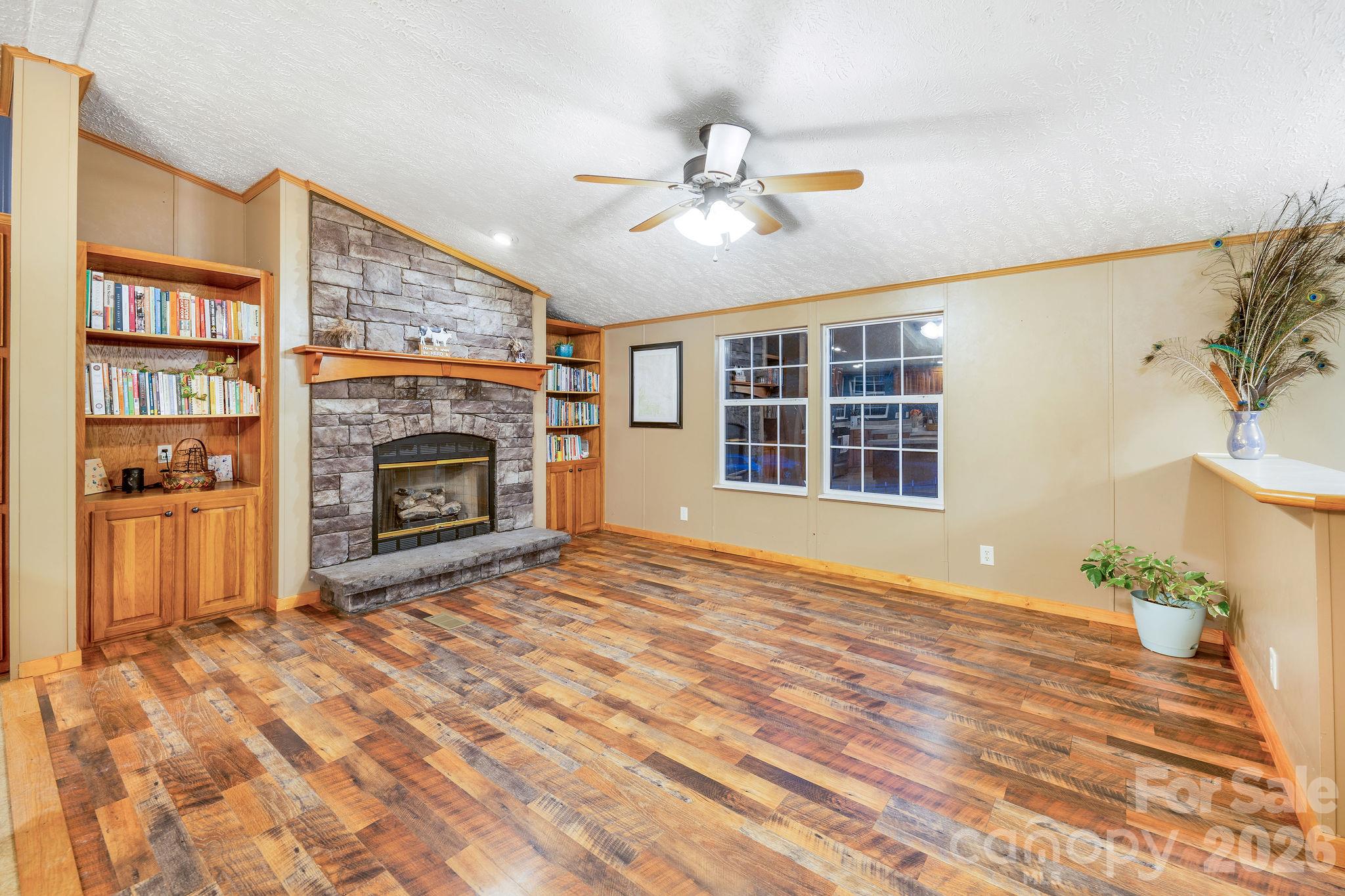 Den with fireplace and built-ins. - 1102 Price Town Road, Clyde