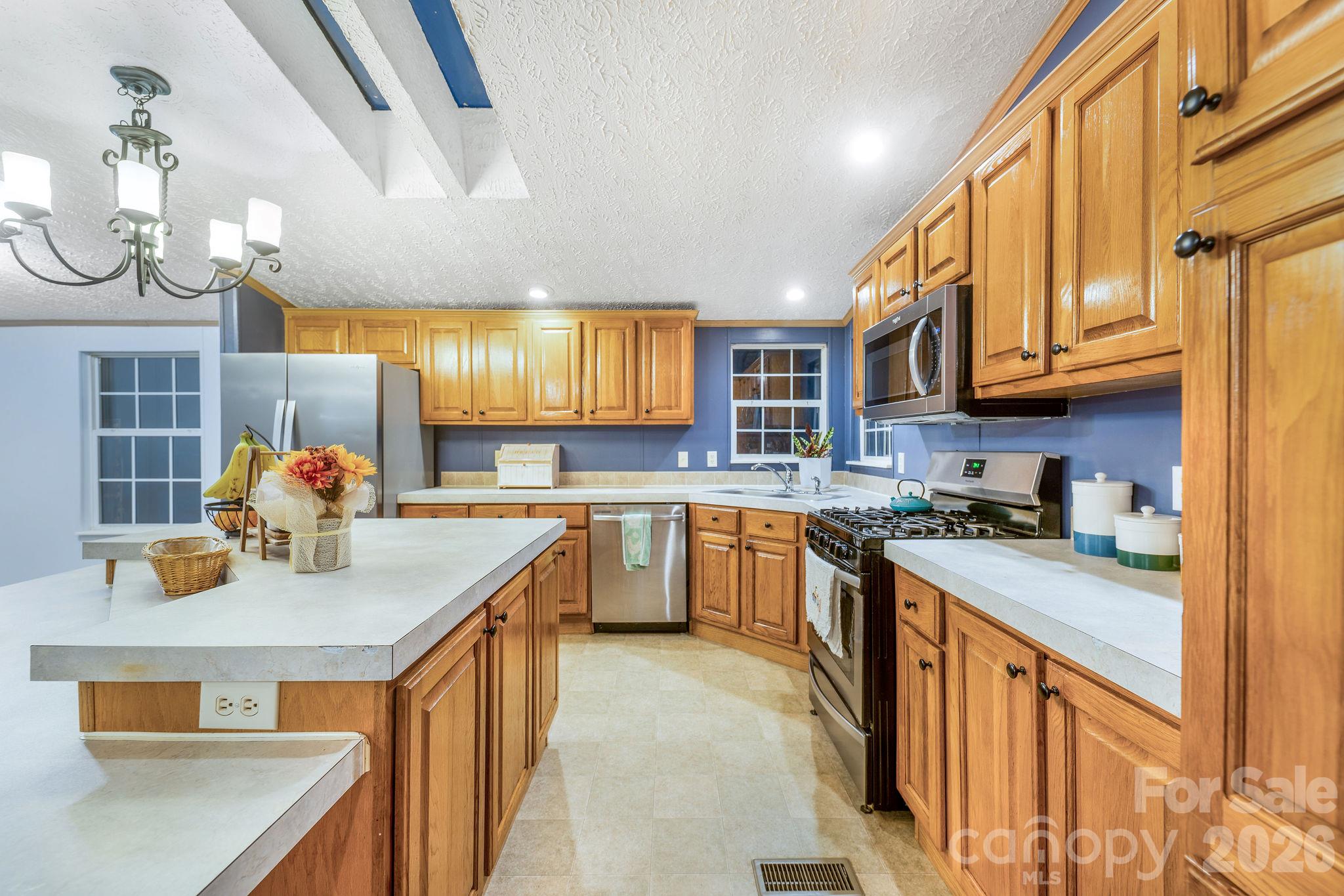 View of kitchen from the other side of the island. - 1102 Price Town Road, Clyde