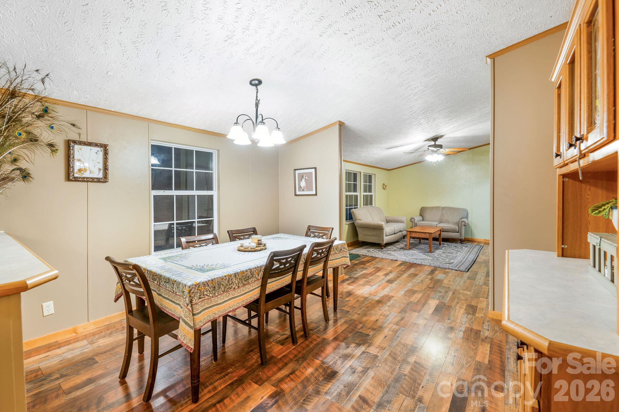 View of dining room and living room beyond. - 1102 Price Town Road, Clyde