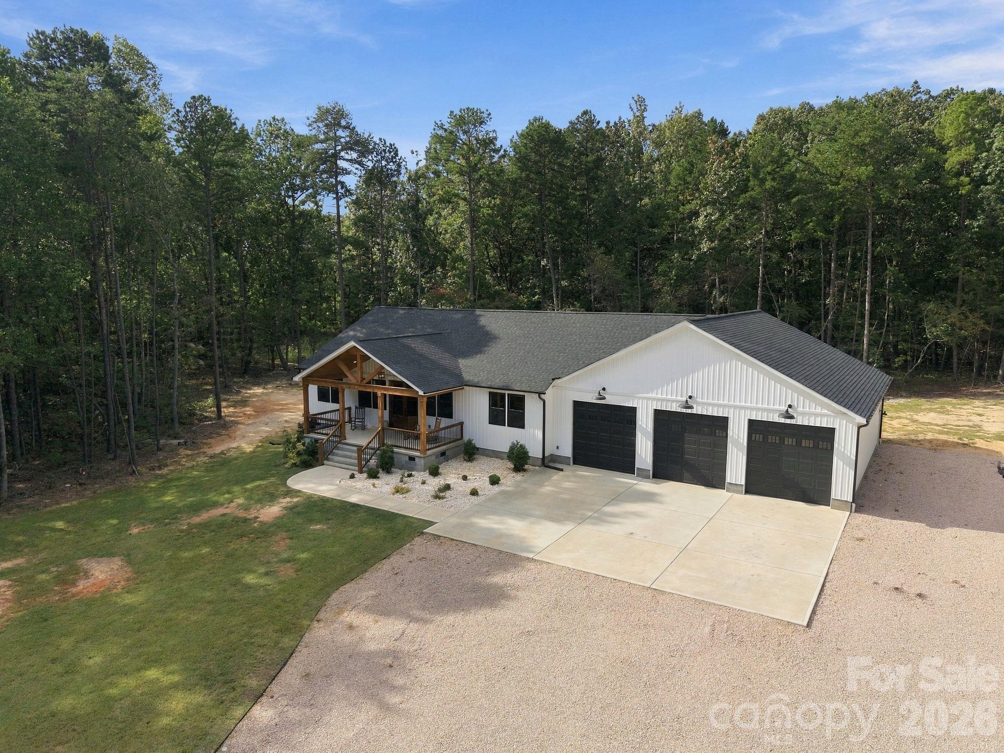 Custom built home sitting on 9+ acres with an over 1600 square foot garage with 3 10x10 doors! - 1020 Rock Pond Lane, Salisbury