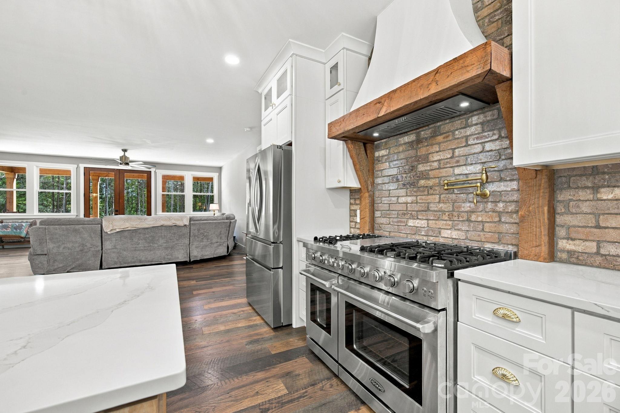 Convenient pot filler with brick backsplash - 1020 Rock Pond Lane, Salisbury