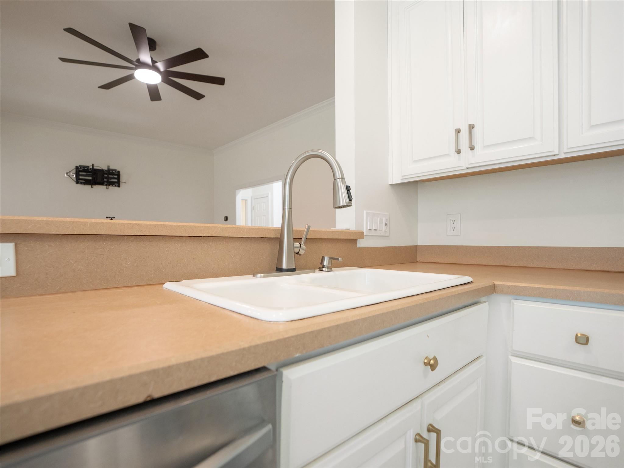 Touch operated kitchen faucet at the sink area that overlooks into the living room - 1011 Overhill Road, Salisbury