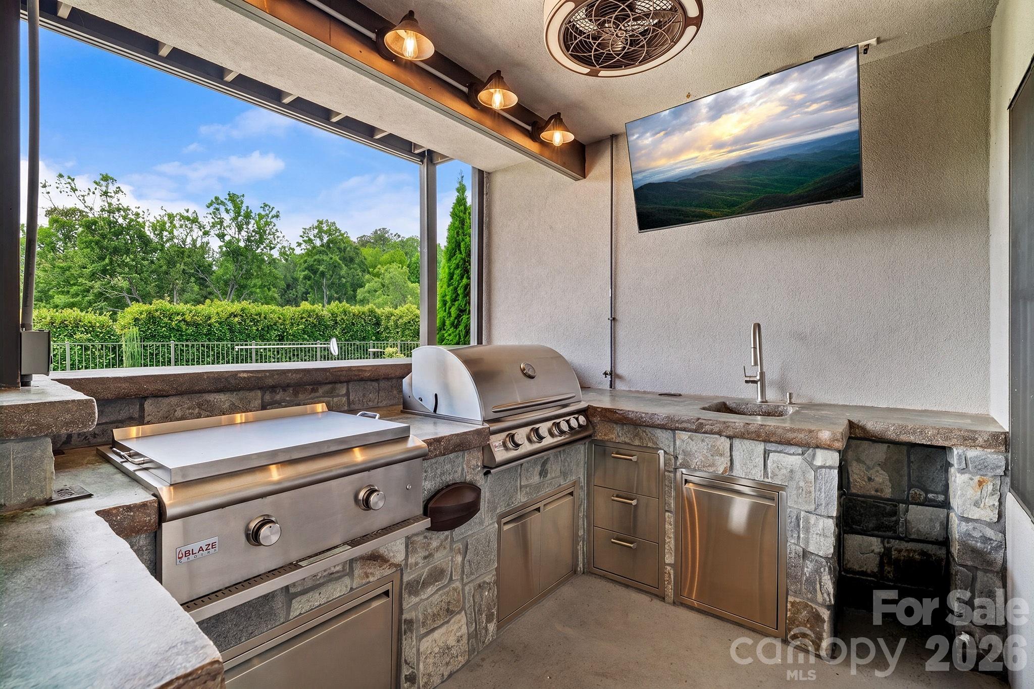 fully equipped outdoor kitchen w/a Blaze 4-burner grill, cast iron sink, and in-ground gas hibachi - 64 Water Hill Way, Fletcher