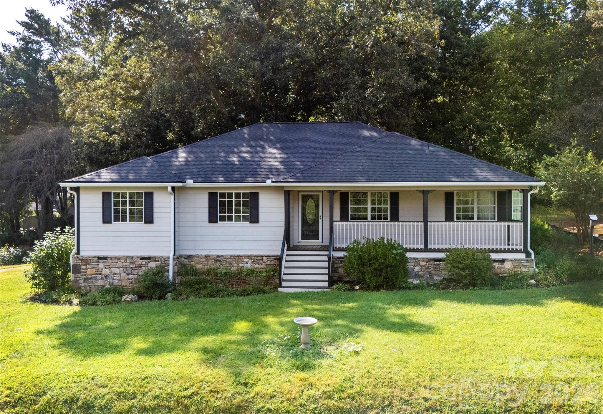 Almost flat yard, classic front porch, and very little street traffic. - 540 Old Haw Creek Road, Asheville