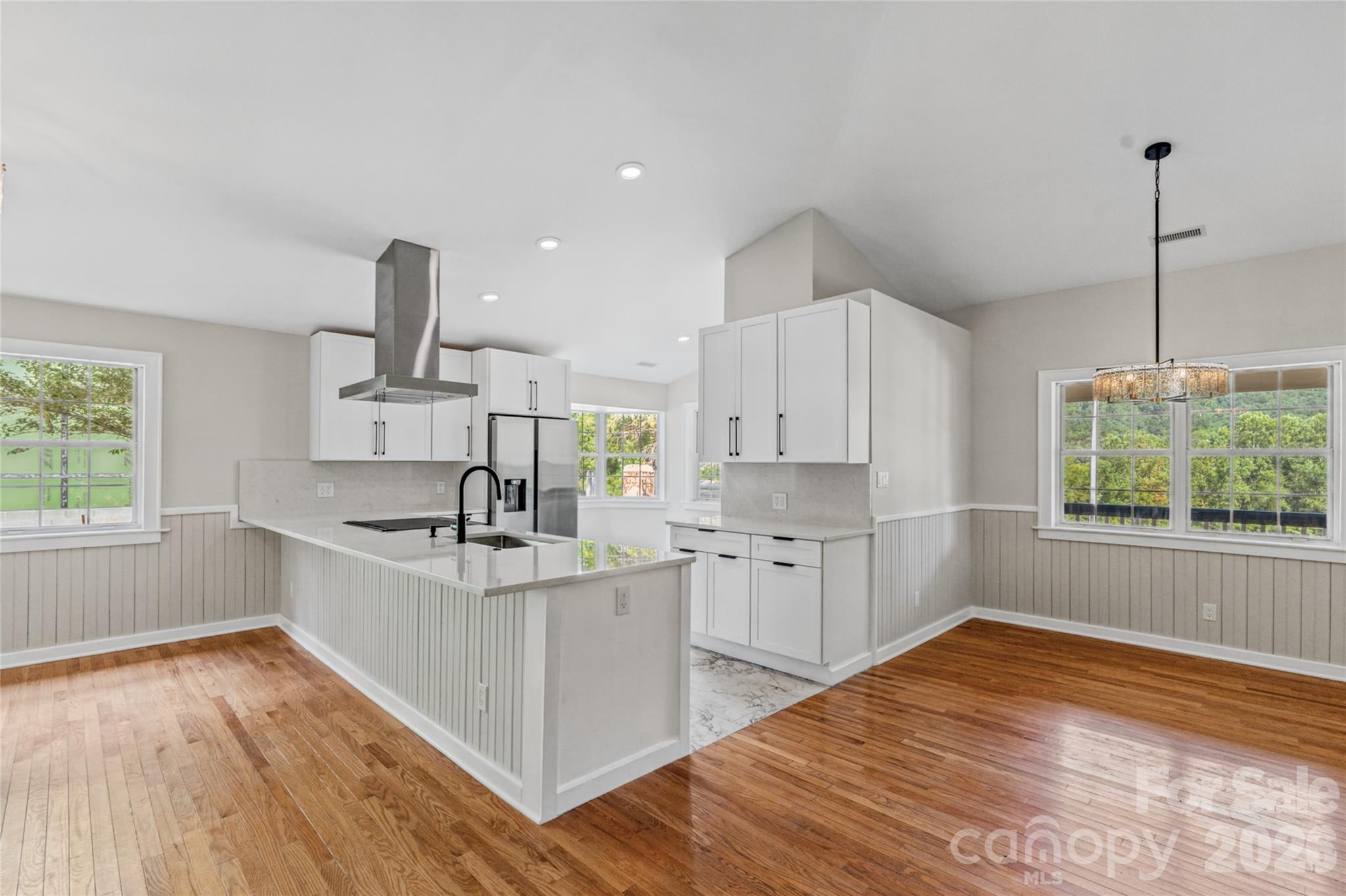 Updated kitchen, dining room, and countertop bar space. - 540 Old Haw Creek Road, Asheville