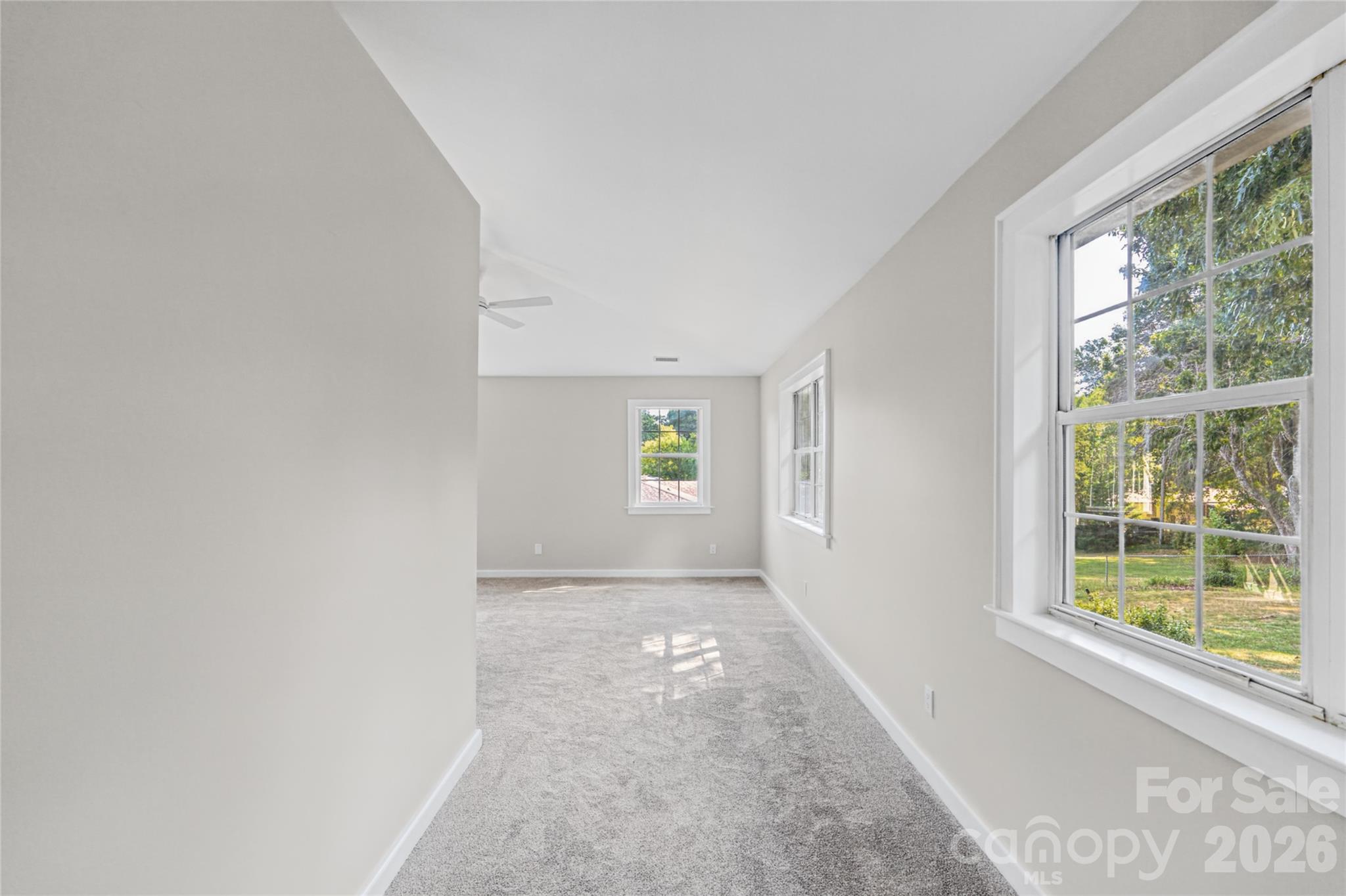 Extra space in the primary leads to the back porch. Perfect for extra storage, sitting area, or office. - 540 Old Haw Creek Road, Asheville