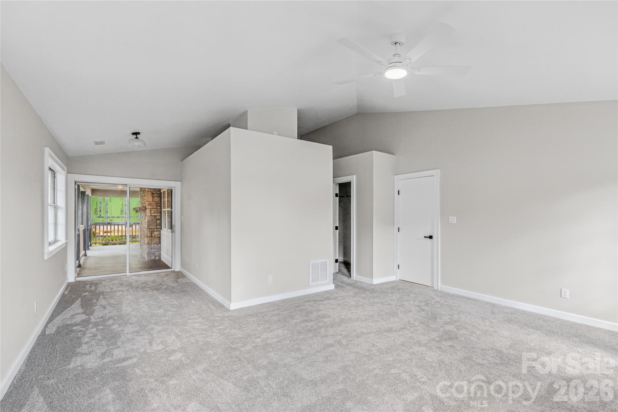 Extra space in the primary leads to the back porch. Perfect for extra storage, sitting area, or office. - 540 Old Haw Creek Road, Asheville