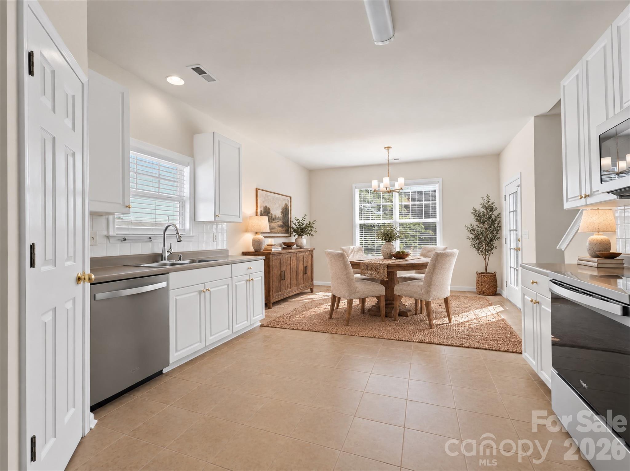Virtually staged kitchen and dining area - 15 Chowan Drive, Fletcher