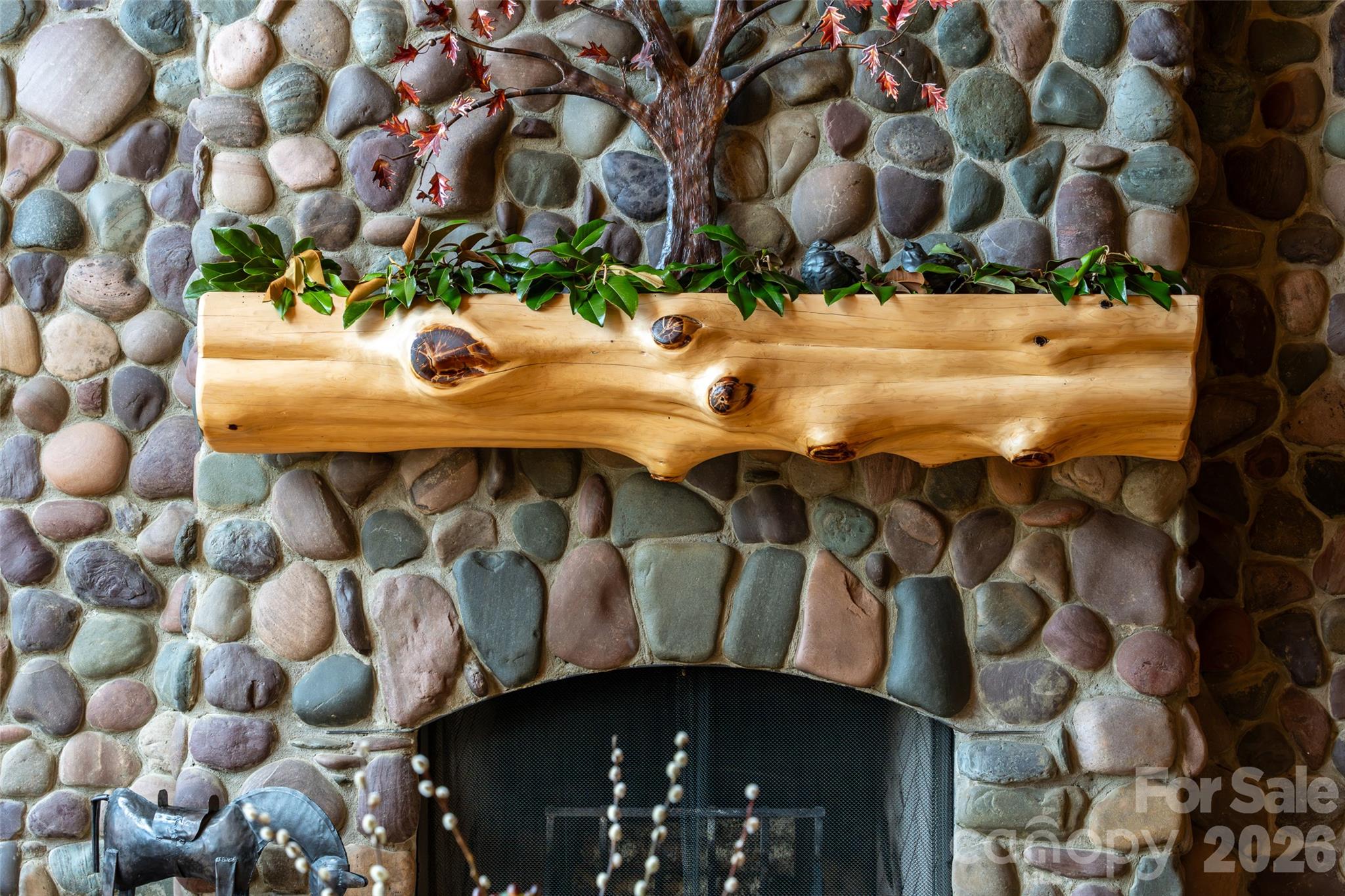 Colorado rock fireplace with cedar log. - 316 Stevenson Cove Road, Waynesville