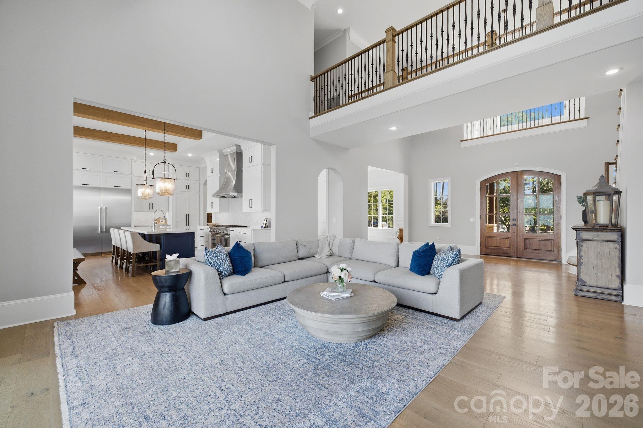 Open great room showcasing the home’s impressive scale and architecture. - 112 Birdsong Lane, Mooresville