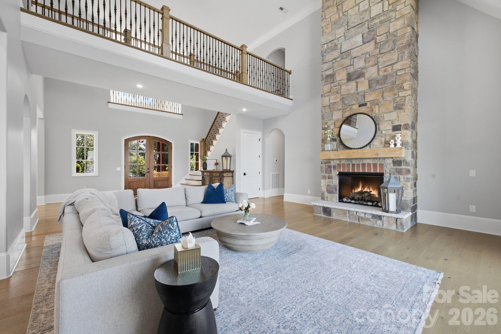 Statement fireplace anchors the spacious main-level great room. - 112 Birdsong Lane, Mooresville