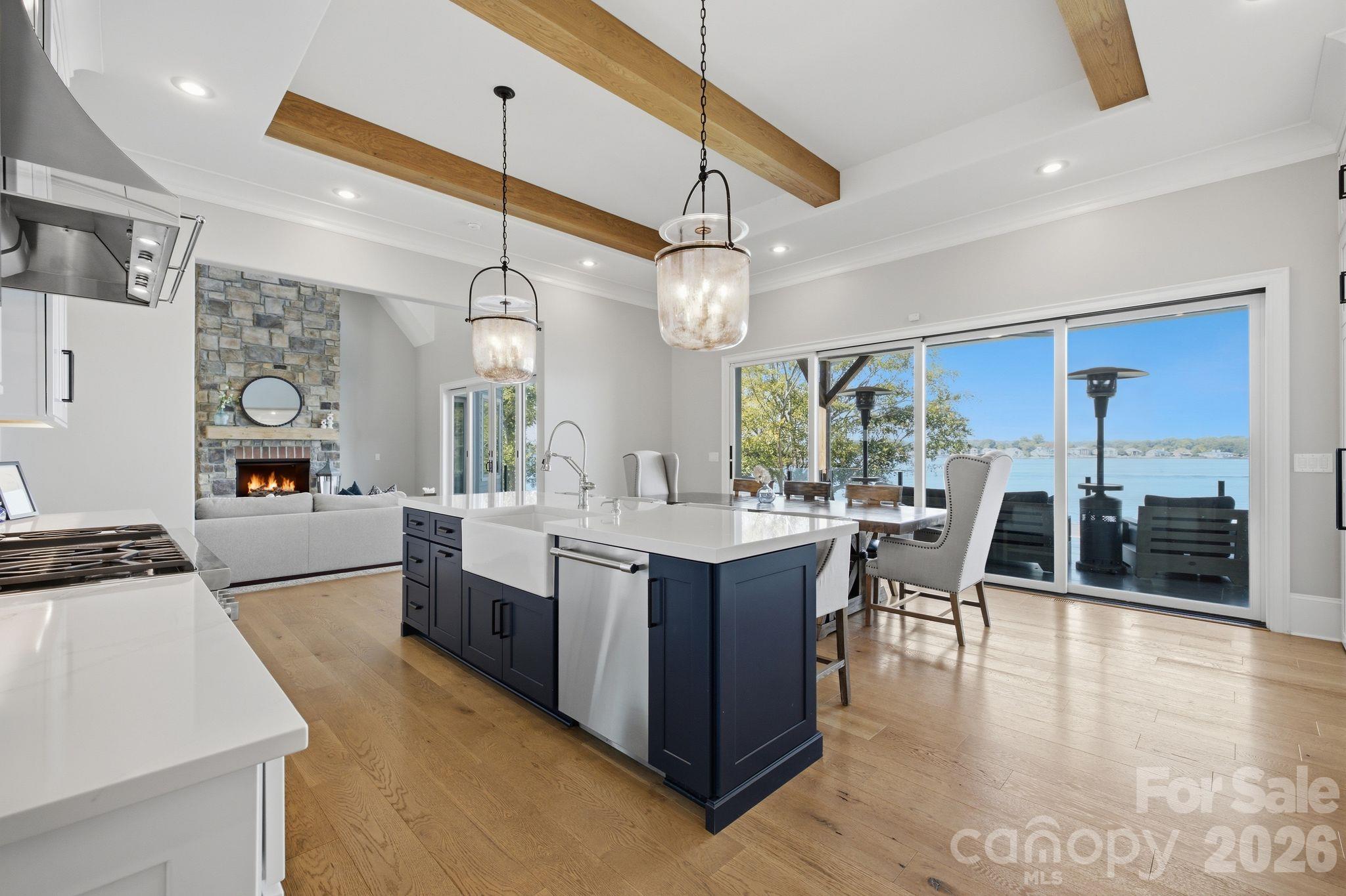 Gourmet kitchen opening seamlessly to the casual dining area. - 112 Birdsong Lane, Mooresville