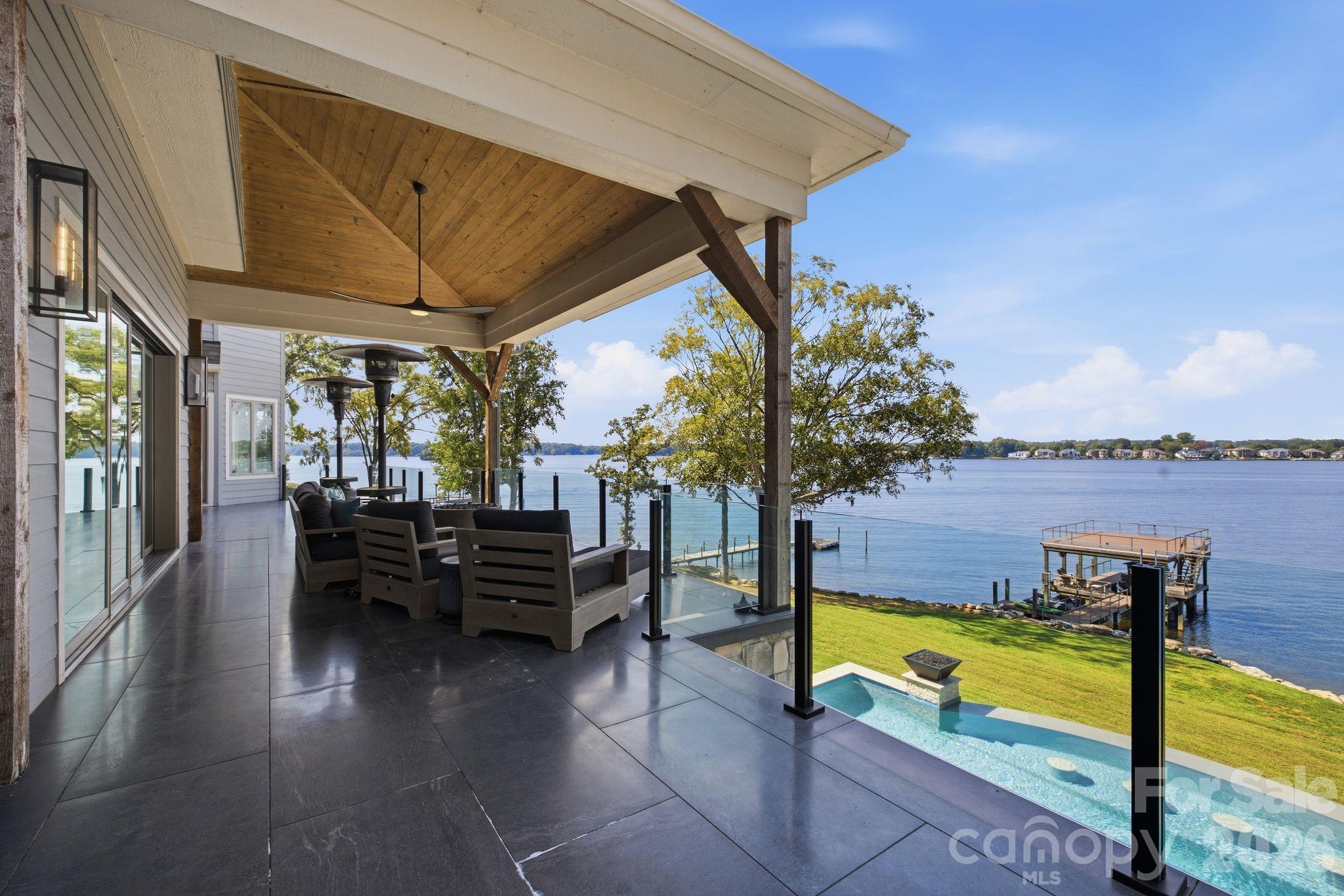 Expansive covered outdoor living area off main level overlooking the Lake. - 112 Birdsong Lane, Mooresville