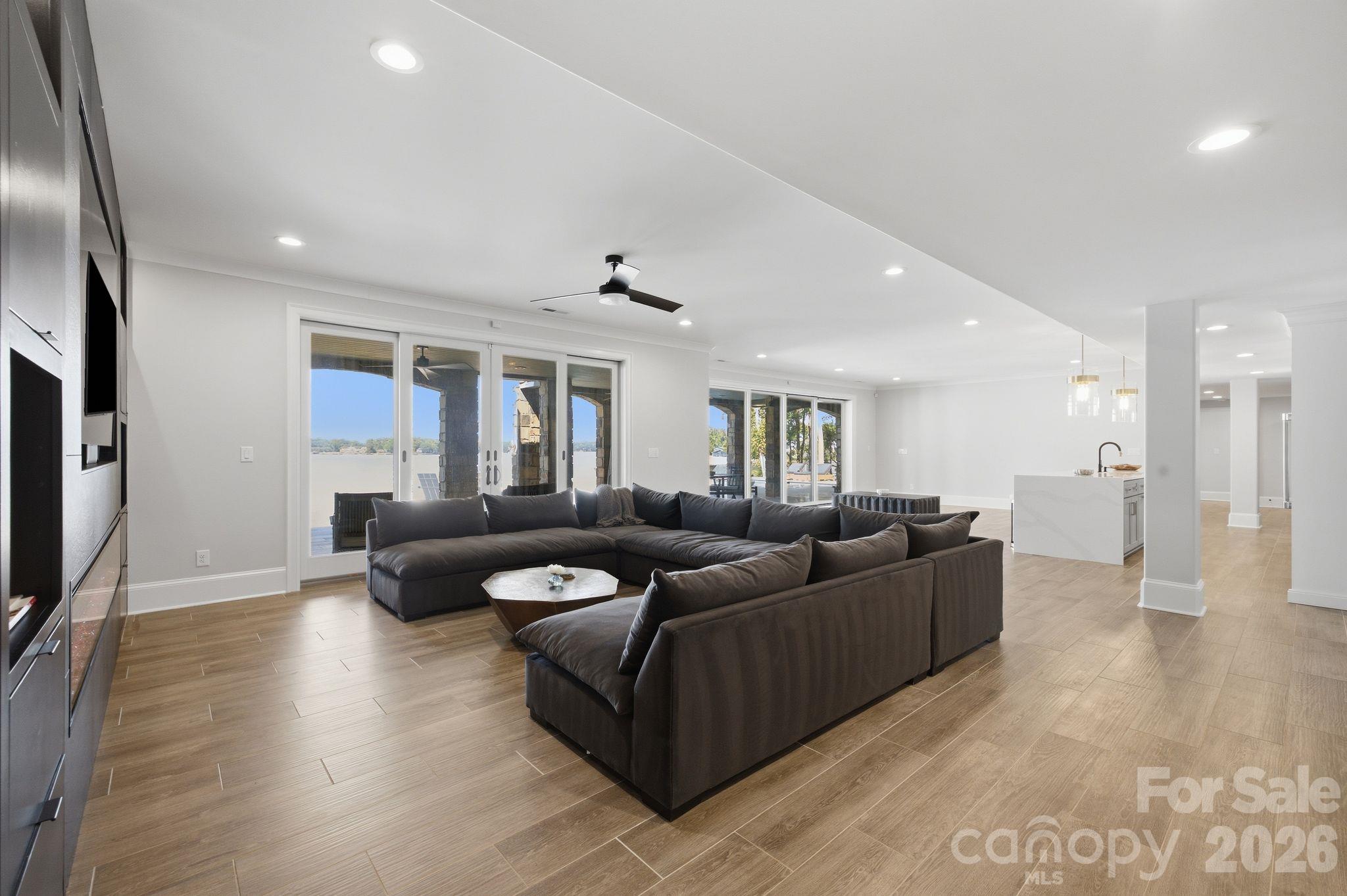 Pool level living room & entertainment space. - 112 Birdsong Lane, Mooresville
