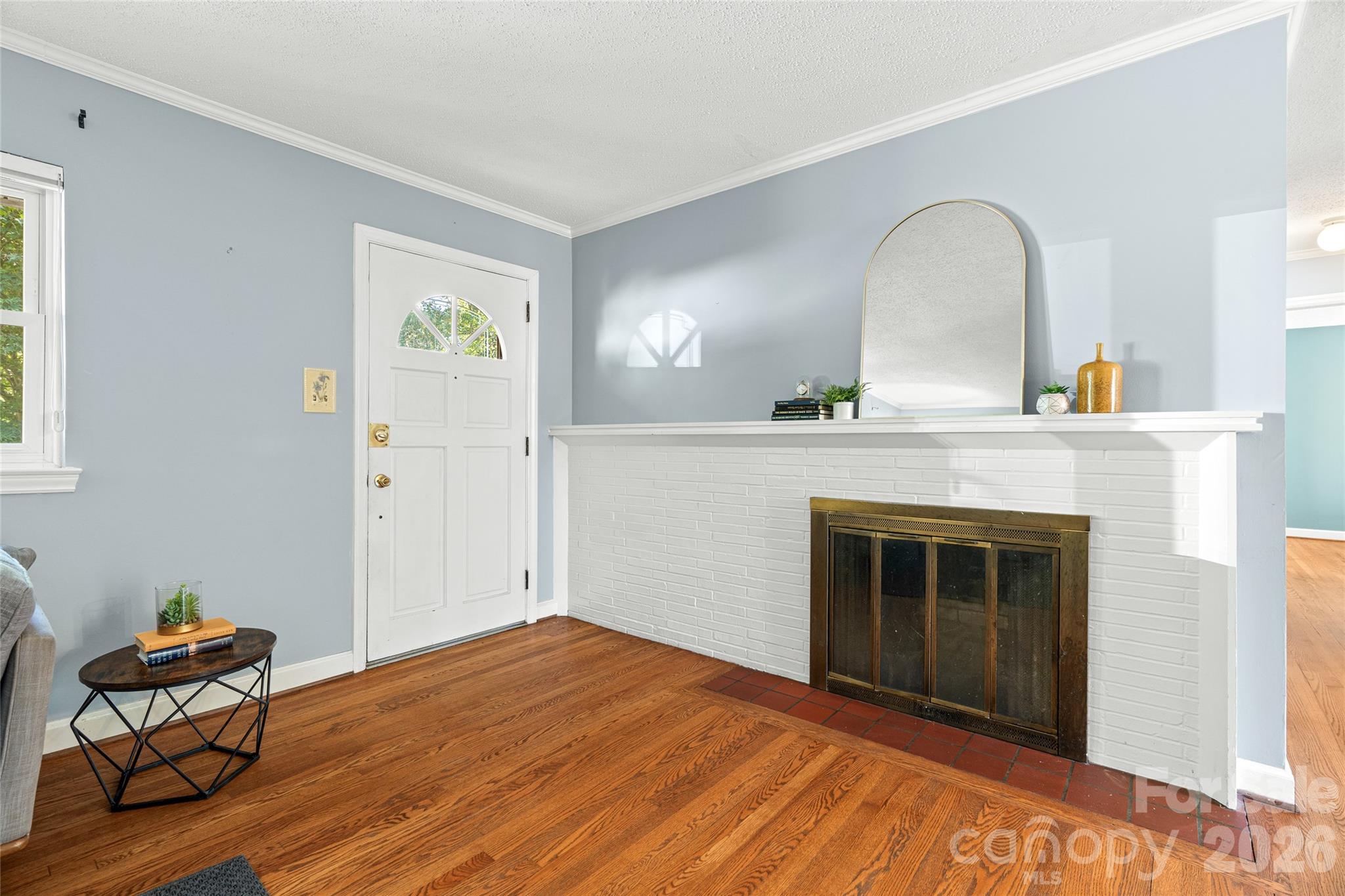 Enter to discover hardwood floors and cozy fireplace. - 18 Northwood Road, Asheville