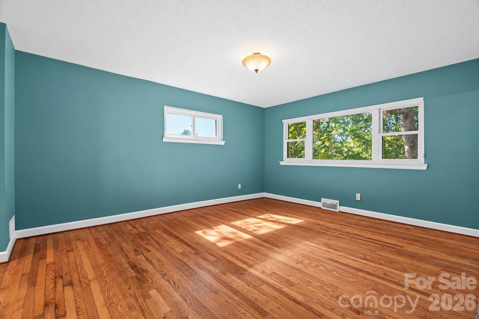Large Primary Bedroom on main level. - 18 Northwood Road, Asheville