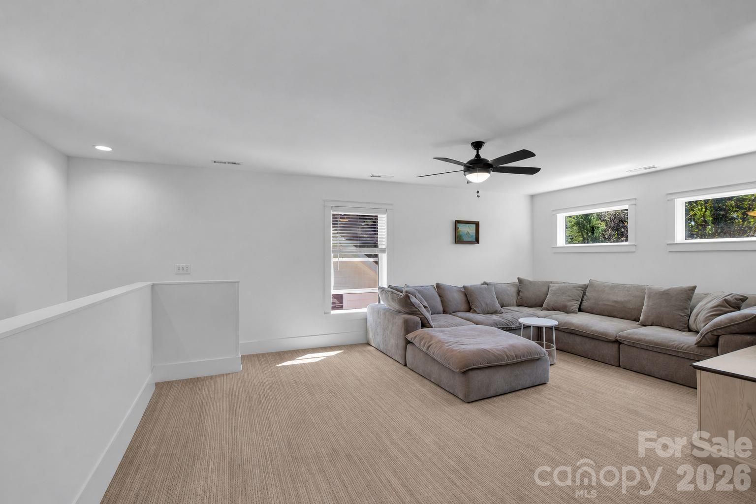 Enjoy the plush new carpet in this 2nd living room space - 92 Rumbough Place, Asheville