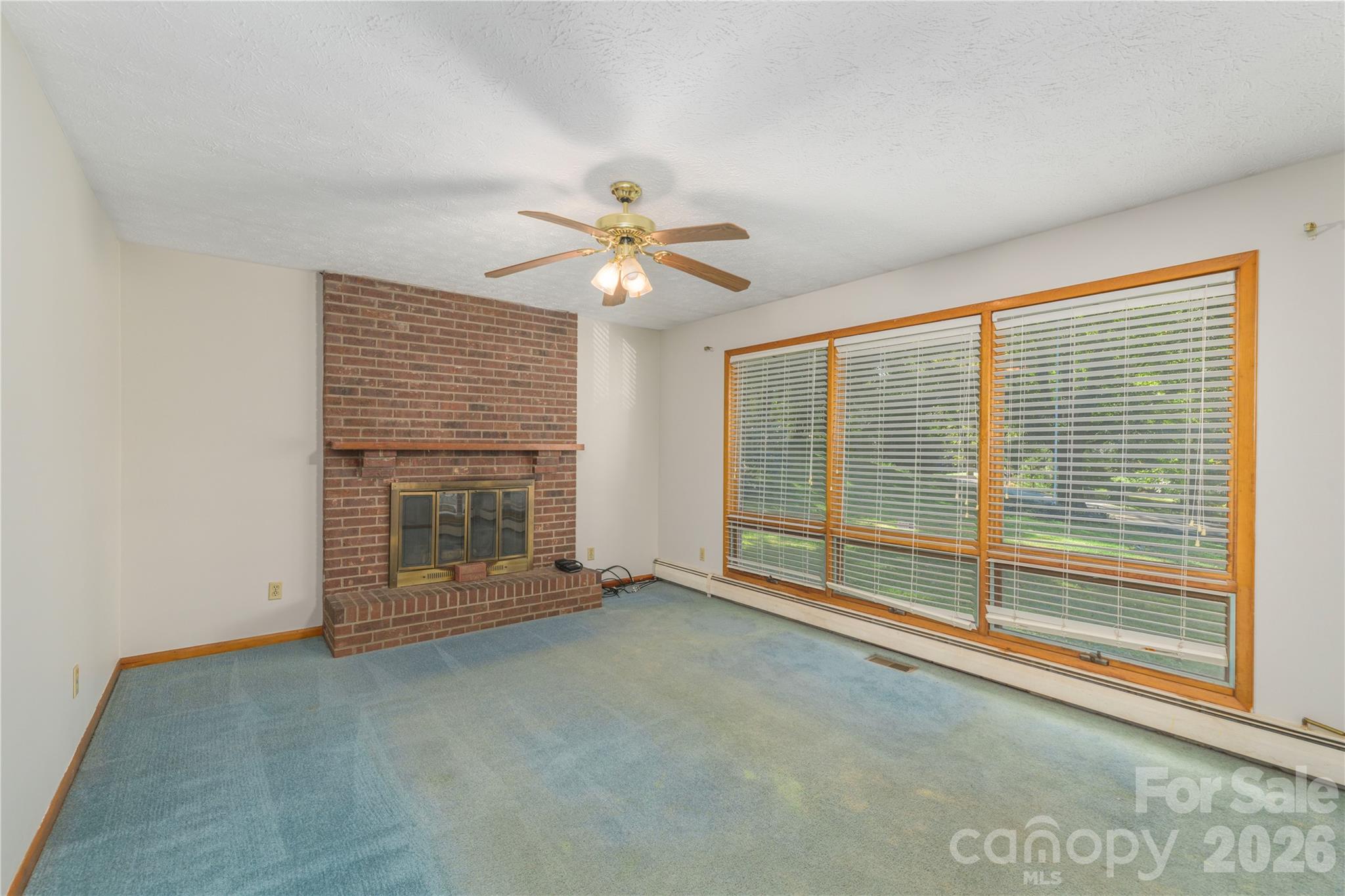 Living Room with Wood Fireplace - 2882 Butler Bridge Road, Mills River
