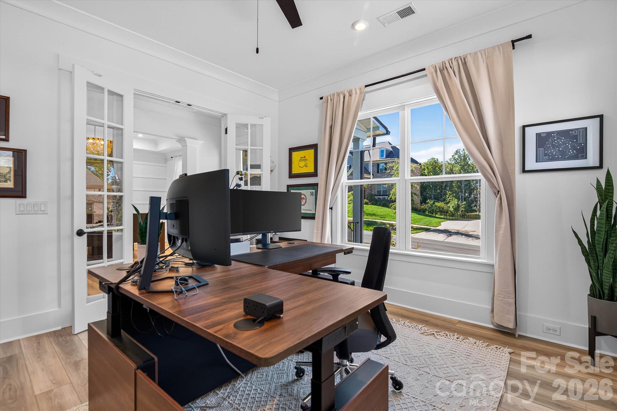 Your focus space, fully yours. French doors means focus when you need it, flow when you don't. - 1216 Glade Arch Lane, Huntersville