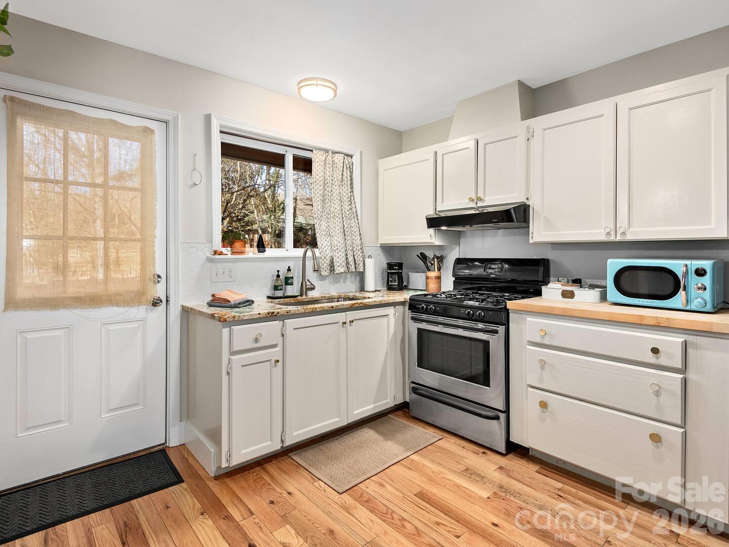 Kitchen with gas stove in separate apartment - 16 Melton Drive, Asheville