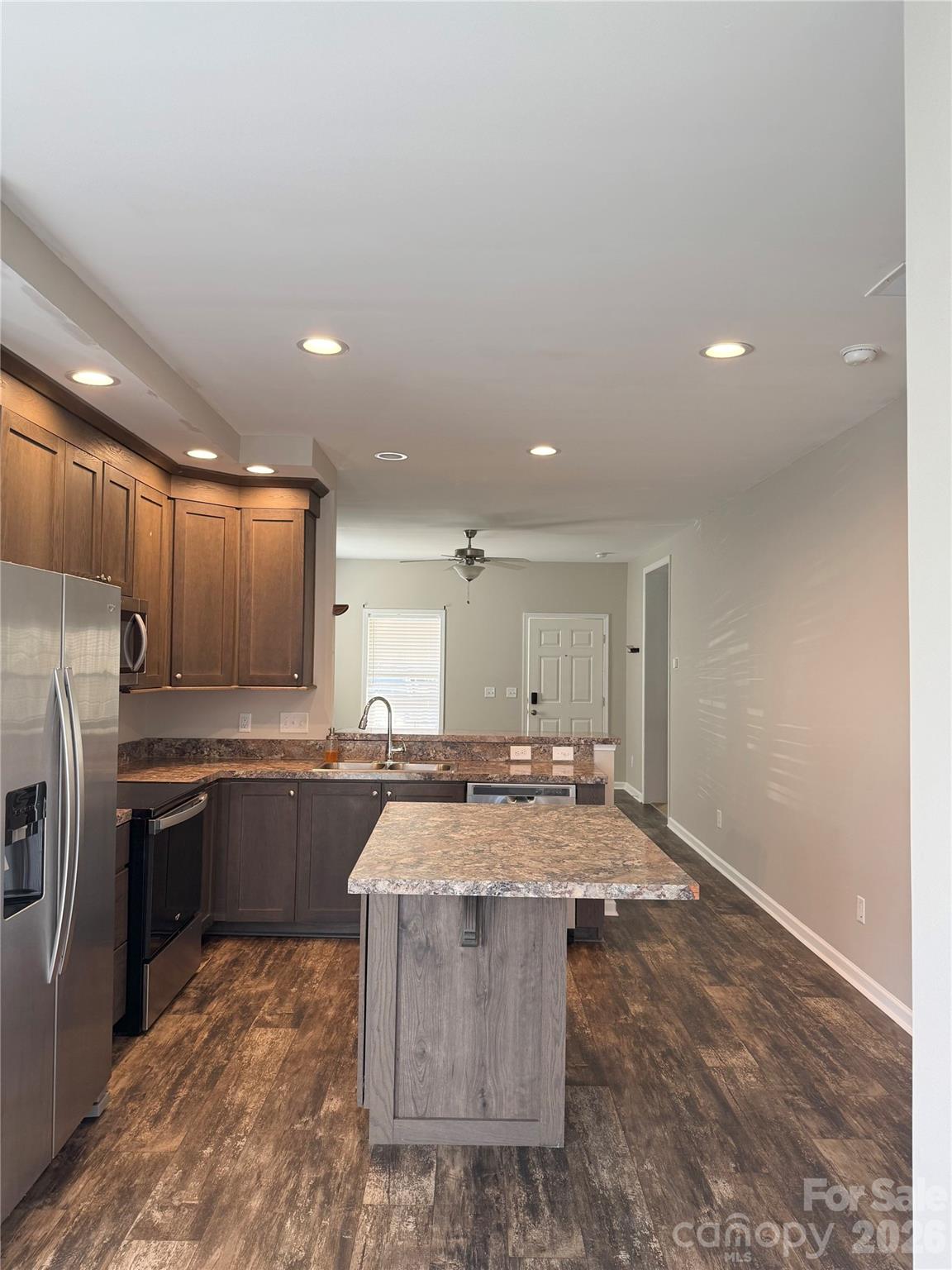 open floorpan looking from breakfast nook to the living room. - 323 Martin Street, Shelby