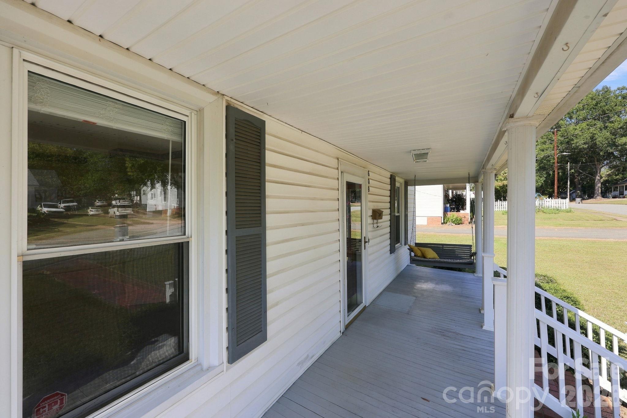 This porch is perfect for sipping coffee on and enjoying the Carolina weather! - 609 Poplar Avenue, Kannapolis