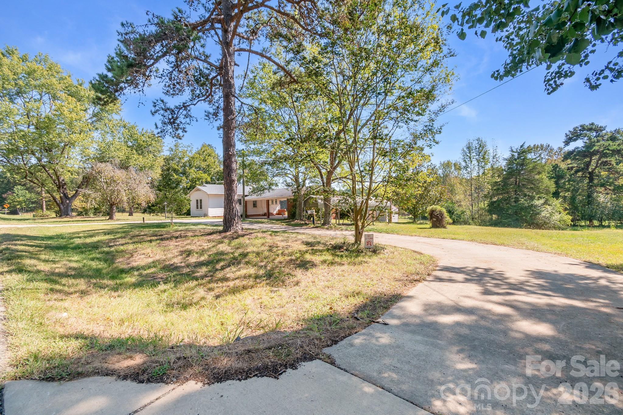 2 way circular driveway - 7615 S Rocky River Road, Monroe