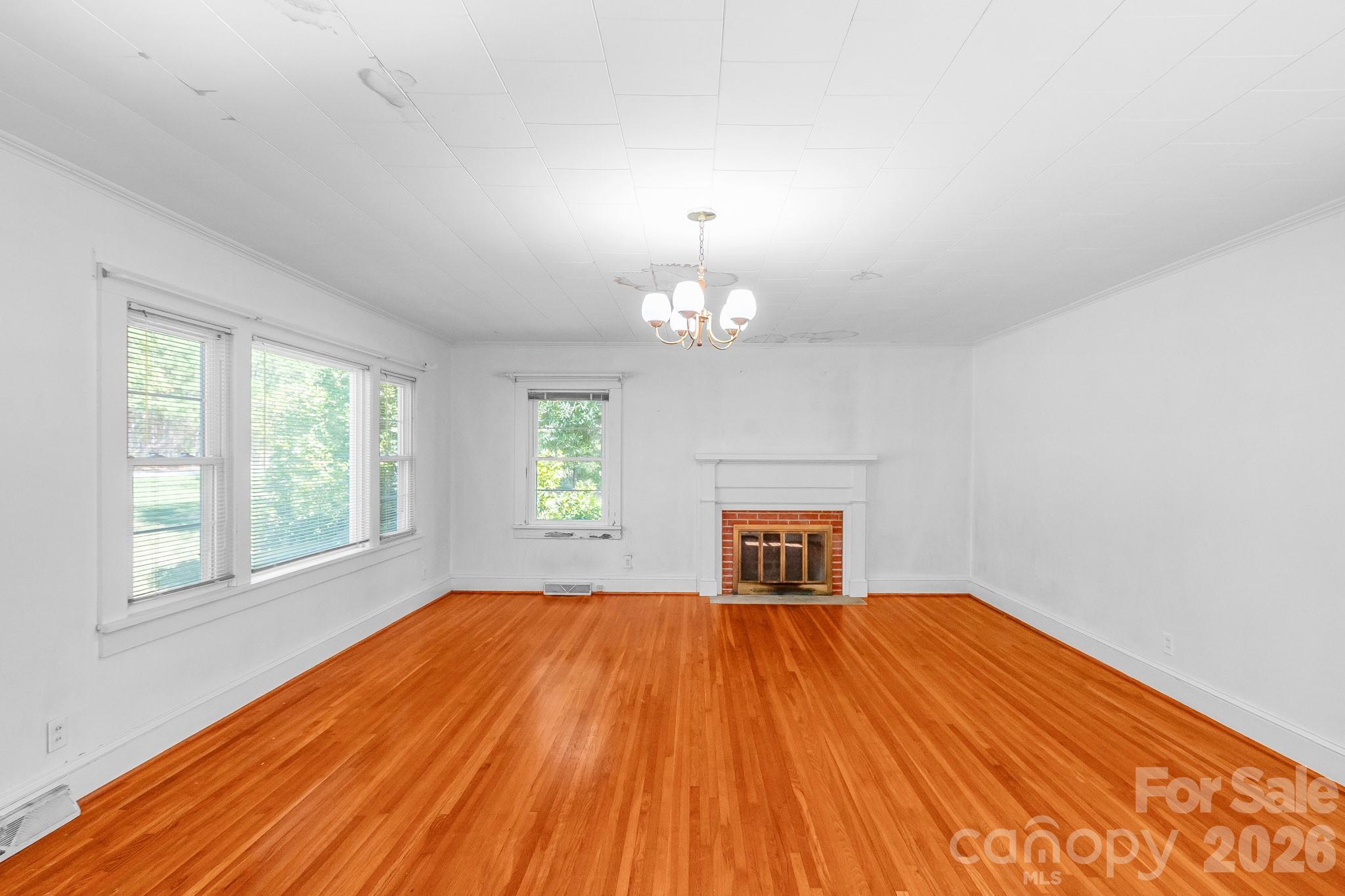 Living Room with Fireplace - 7615 S Rocky River Road, Monroe