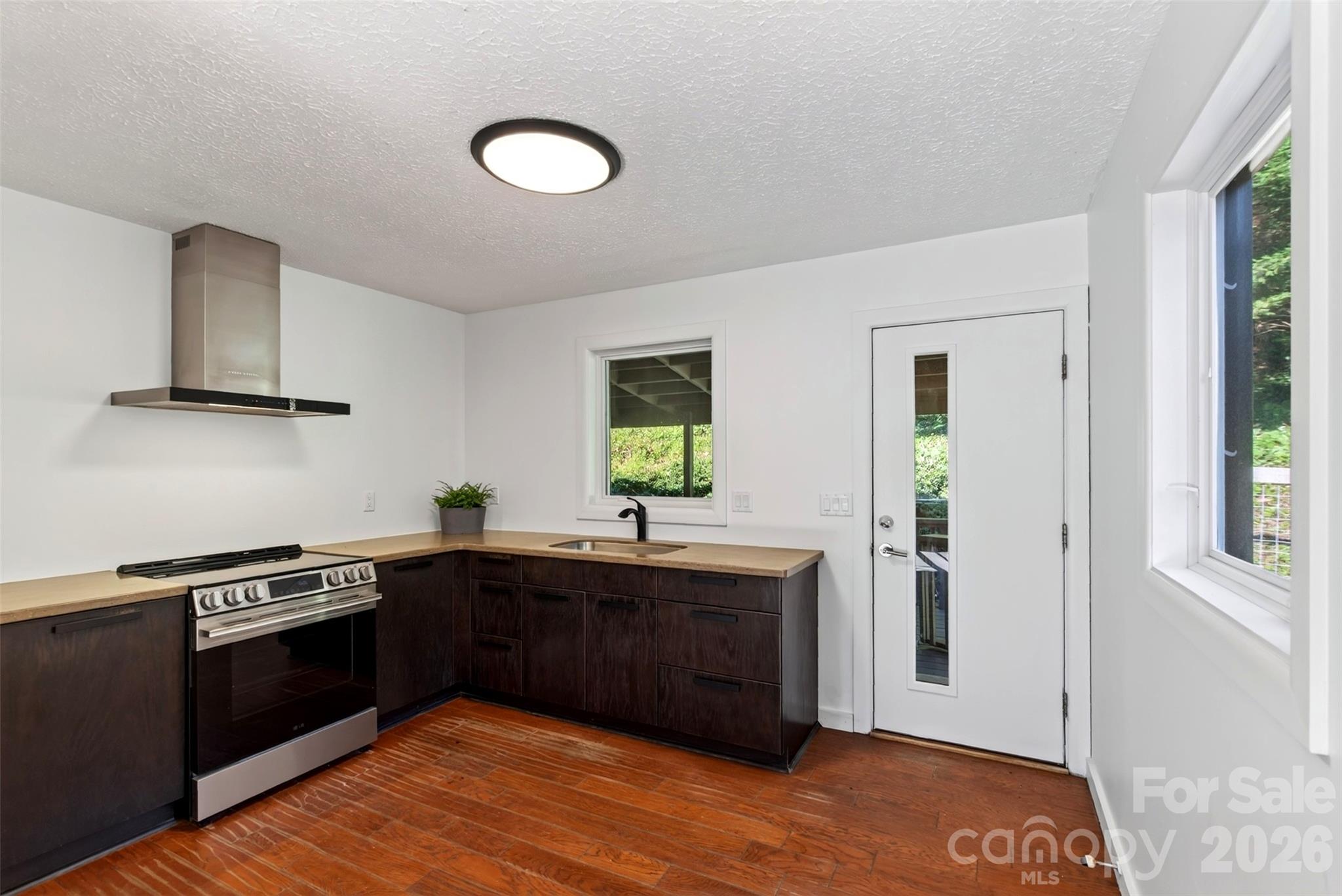 modern kitchen with back deck access - 53 Hemlock Street, Arden