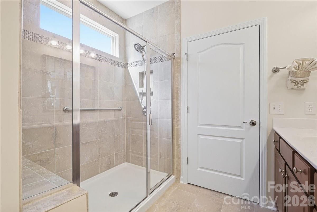 Primary bath shower w/tile and glass doors - 389 Harvest Valley Lane, Fort Mill