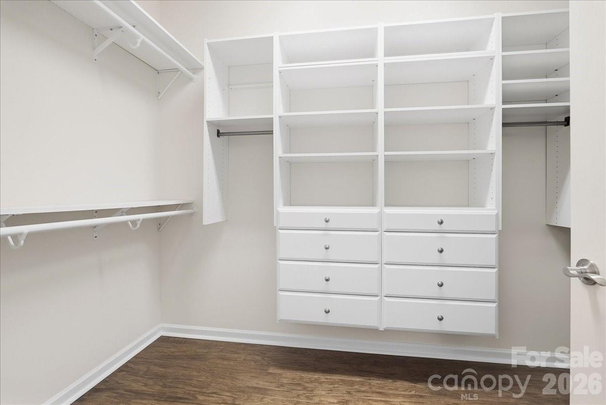 Primary bedroom walk-in closet w/custom cabinets - 389 Harvest Valley Lane, Fort Mill